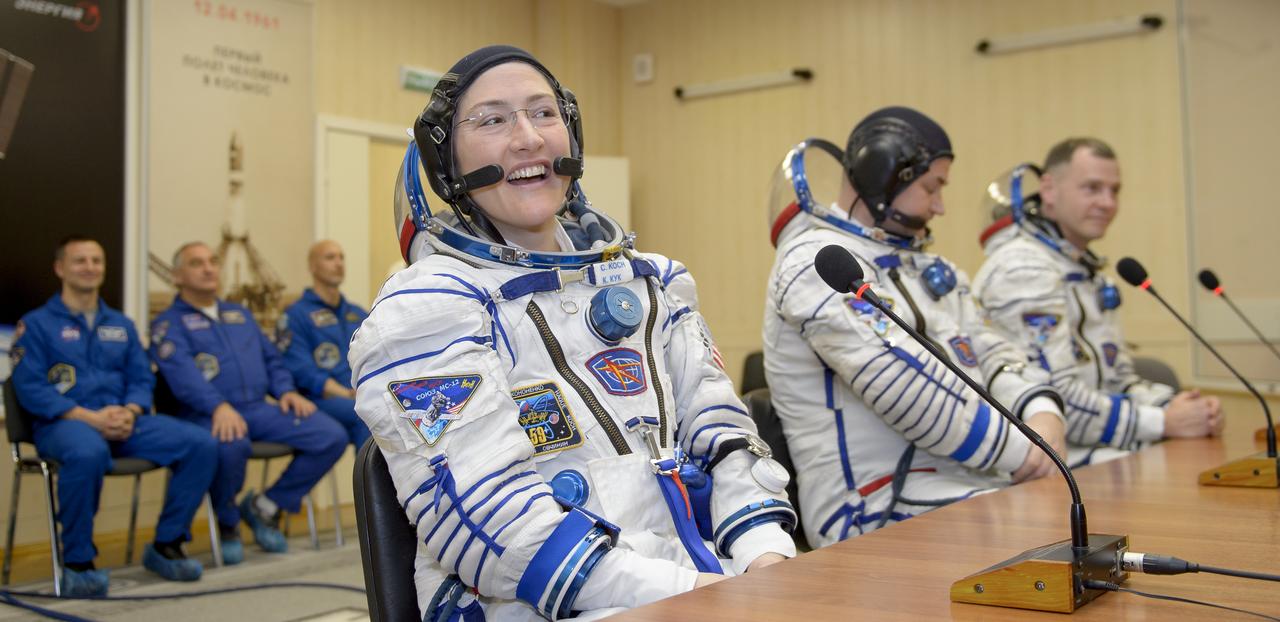 Expedition 59 crewmembers Christina Koch of NASA, left, Alexey Ovchinin of Roscosmos, and Nick Hague of NASA, right, talk with family and mission management prior to their launch, Thursday, March 14, 2019 at the Baikonur Cosmodrome in Kazakhstan. Hague, Koch, and Ovchinin launched March 14, U.S. time, on the Soyuz MS-12 spacecraft from the Baikonur Cosmodrome for a six-and-a-half month mission on the International Space Station. Photo Credit: (NASA/GCTC/Irina Spector)