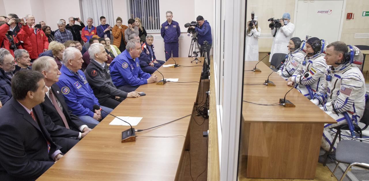 Expedition 59 crewmembers Christina Koch of NASA, Alexey Ovchinin of Roscosmos and Nick Hague of NASA, talk with family and mission management prior to their launch, Thursday, March 14, 2019 at the Baikonur Cosmodrome in Kazakhstan. Hague, Koch, and Ovchinin launched March 14, U.S. time, on the Soyuz MS-12 spacecraft from the Baikonur Cosmodrome for a six-and-a-half month mission on the International Space Station. Photo Credit: (NASA/Victor Zelentsov)