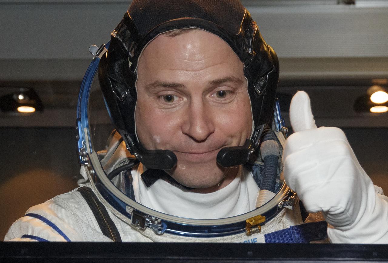 Expedition 59 astronaut Nick Hague of NASA, gives a thumbs up to family and friends as he, Alexey Ovchinin of Roscosmos, and Christina Koch of NASA head to the launch pad, Thursday, March 14, 2019 at the Baikonur Cosmodrome in Kazakhstan. Hague, Koch, and Ovchinin launched March 14, U.S. time, on the Soyuz MS-12 spacecraft from the Baikonur Cosmodrome for a six-and-a-half month mission on the International Space Station. Photo Credit: (NASA/Victor Zelentsov)