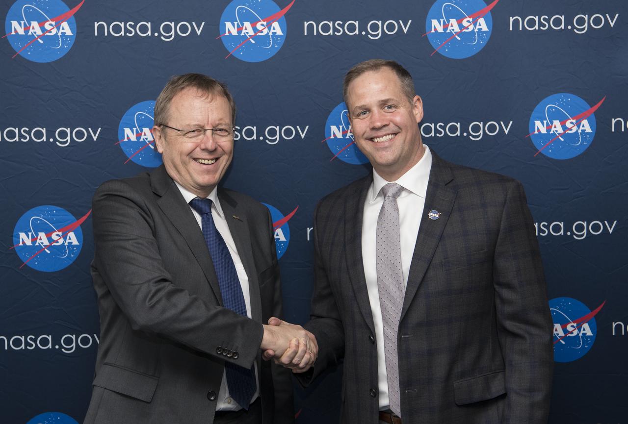 NASA Administrator Jim Bridenstine, right, poses with Johann-Dietrich Wörner, director general of ESA (European Space Agency), just before meeting to discuss NASA’s plans to land humans on the Moon by 2024 and prospective collaboration in human and robotic lunar and Mars exploration activities, at the Space Symposium, Monday, April 8, 2019 in Colorado Springs, Colorado, They also discussed their continued successful cooperation on the International Space Station and the service module for the Orion spacecraft that will take us to the Moon and beyond. Photo Credit: (NASA/Aubrey Gemignani)