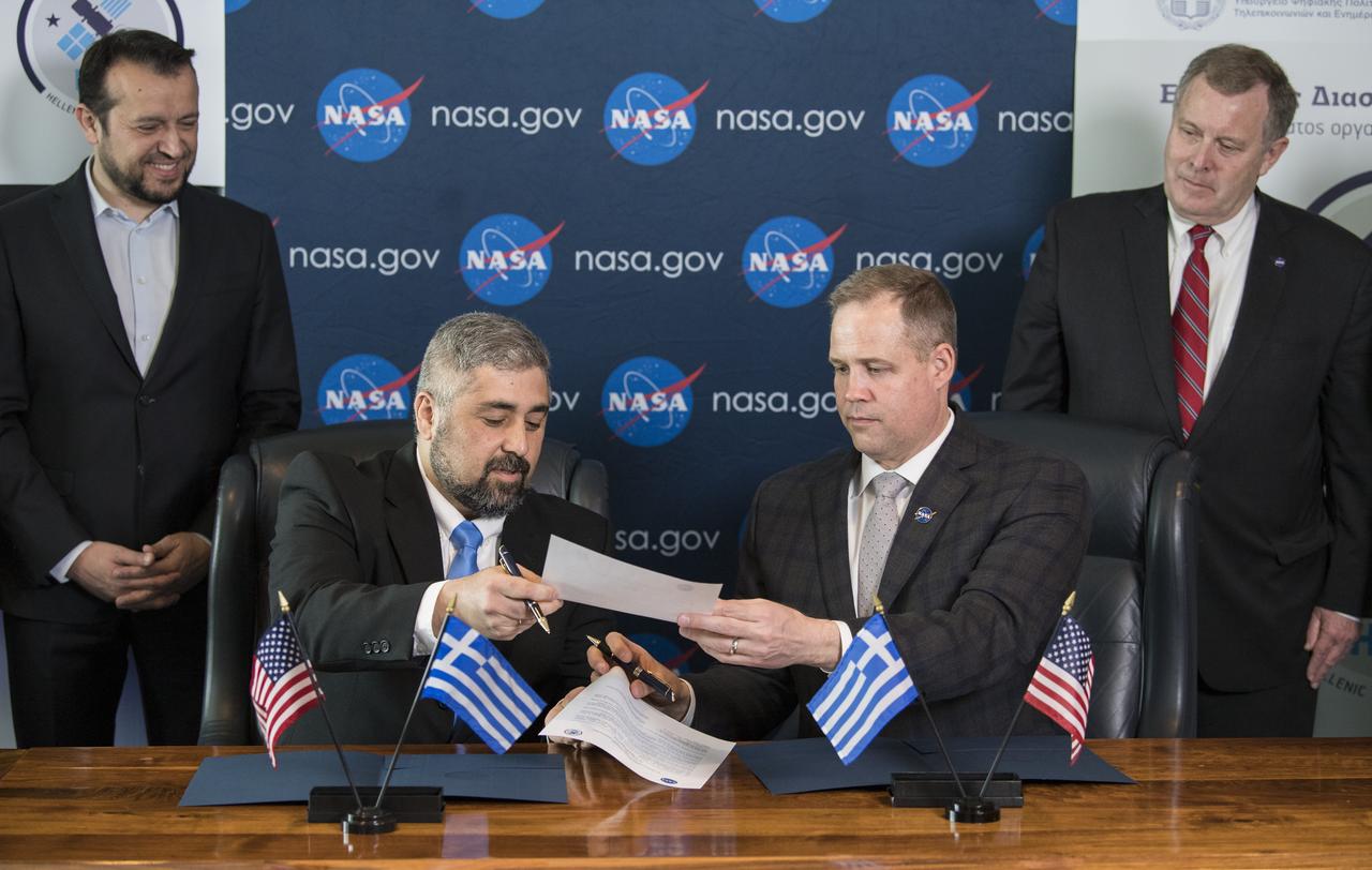 NASA Administrator Jim Bridenstine, right, exchanges a joint statement with the Hellenic Space Agency (HSA) CEO, Dr. Georgios Mantzouris, during a signing ceremony at the Space Symposium, Monday, April 8, 2019 in Colorado Springs, Colorado. Dr. Mantzouris expressed a desire to remain open to opportunities for collaboration, both through Greece’s contributions to the European Space Agency, of which it has been a member since 2005, and bilaterally. Photo Credit: (NASA/Aubrey Gemignani)