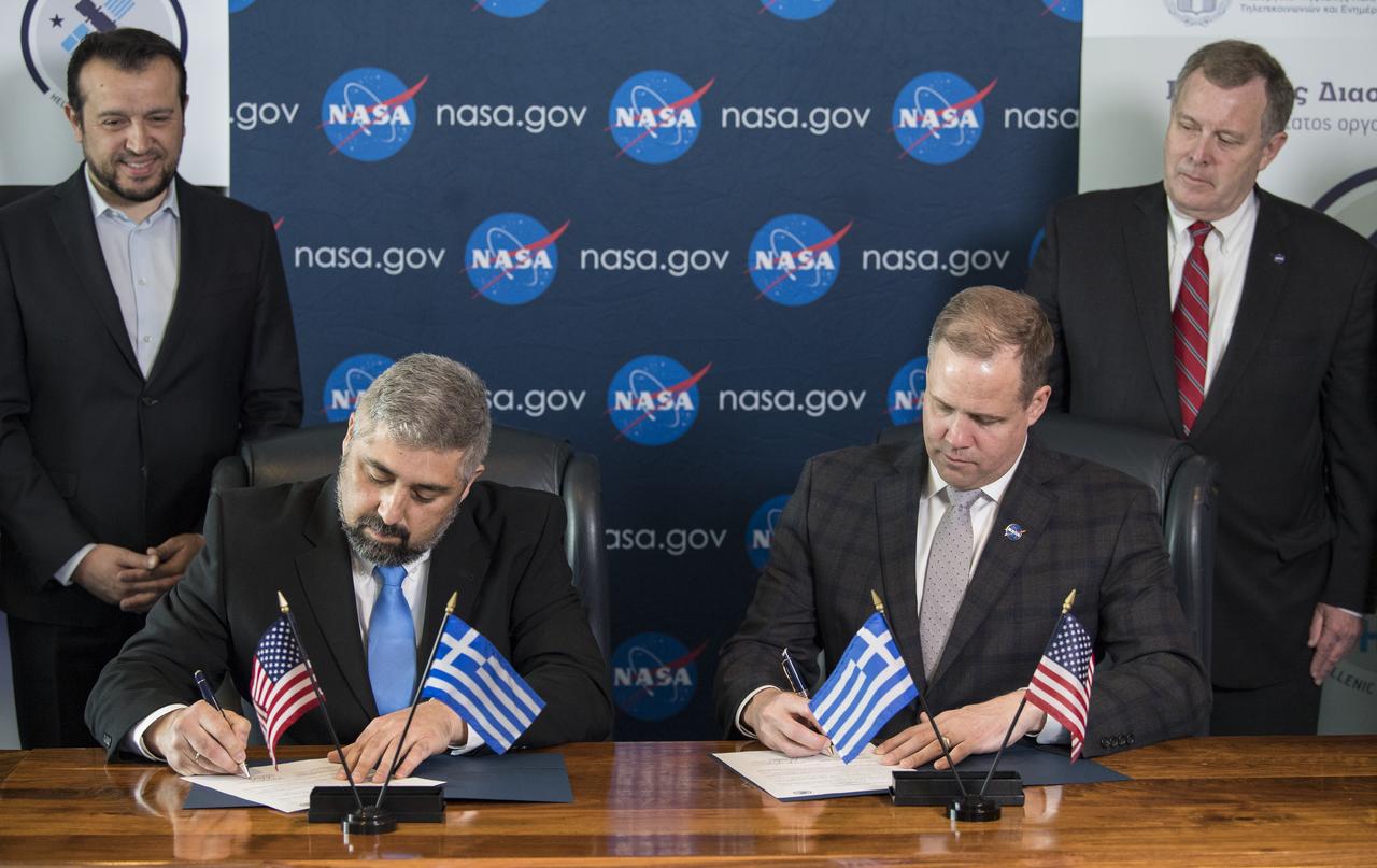 NASA Administrator Jim Bridenstine, right, signs a joint statement with the Hellenic Space Agency (HSA) CEO, Dr. Georgios Mantzouris, at the Space Symposium, Monday, April 8, 2019 in Colorado Springs, Colorado. Dr. Mantzouris expressed a desire to remain open to opportunities for collaboration, both through Greece’s contributions to the European Space Agency, of which it has been a member since 2005, and bilaterally. Photo Credit: (NASA/Aubrey Gemignani)