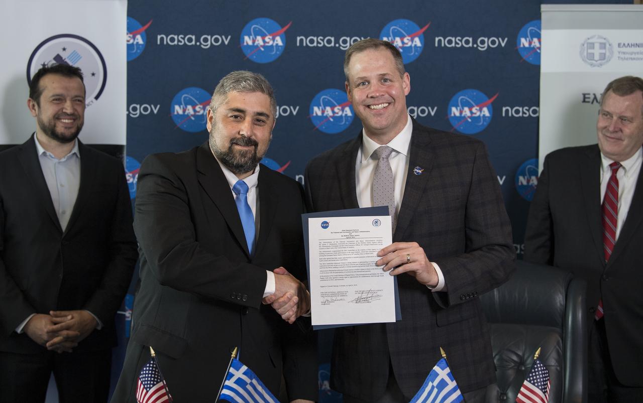 NASA Administrator Jim Bridenstine, right, holds up a joint statement with the Hellenic Space Agency (HSA) CEO, Dr. Georgios Mantzouris, after a signing ceremony at the Space Symposium, Monday, April 8, 2019 in Colorado Springs, Colorado. Dr. Mantzouris expressed a desire to remain open to opportunities for collaboration, both through Greece’s contributions to the European Space Agency, of which it has been a member since 2005, and bilaterally. Photo Credit: (NASA/Aubrey Gemignani)