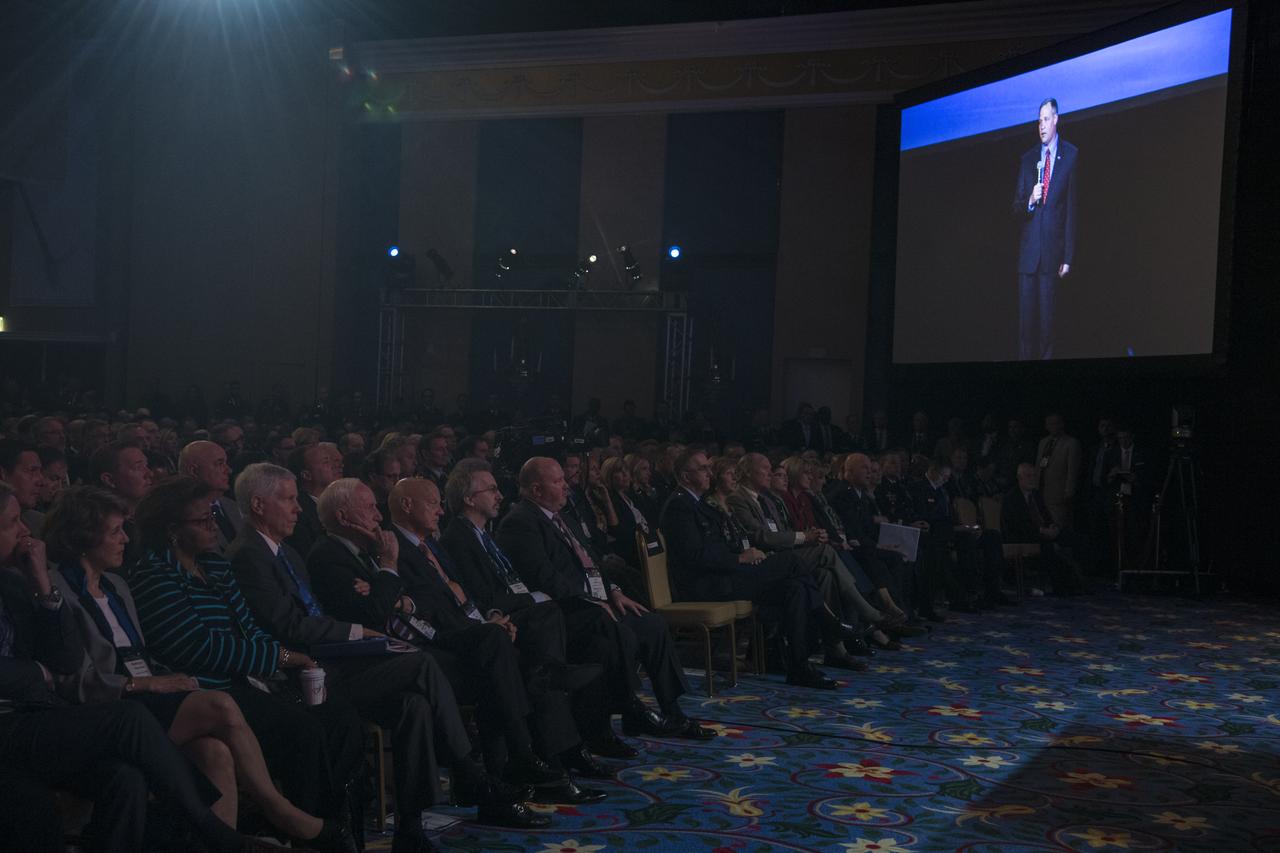 Audience members listen as NASA Administrator Jim Bridenstine gives keynote remarks at the Space Symposium, Tuesday, April 9, 2019, at Broadmoor Hall in Colorado Springs, Colorado. Representatives from the space industry, military, and news media were in attendance. Photo credit: (NASA/Aubrey Gemignani)