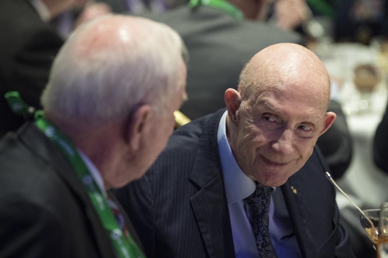 General Thomas Patten Stafford, former NASA astronaut, Air Force officer and test pilot speaks to former astronaut Al Worden in the audience at an event where he received the General James E. Hill Lifetime Achievement Award, at the Space Symposium, Tuesday, April 9, 2019, at Broadmoor Hall in Colorado Springs, Colorado. Former and current NASA Administrators were in attendance. Photo credit: (NASA/Aubrey Gemignani)