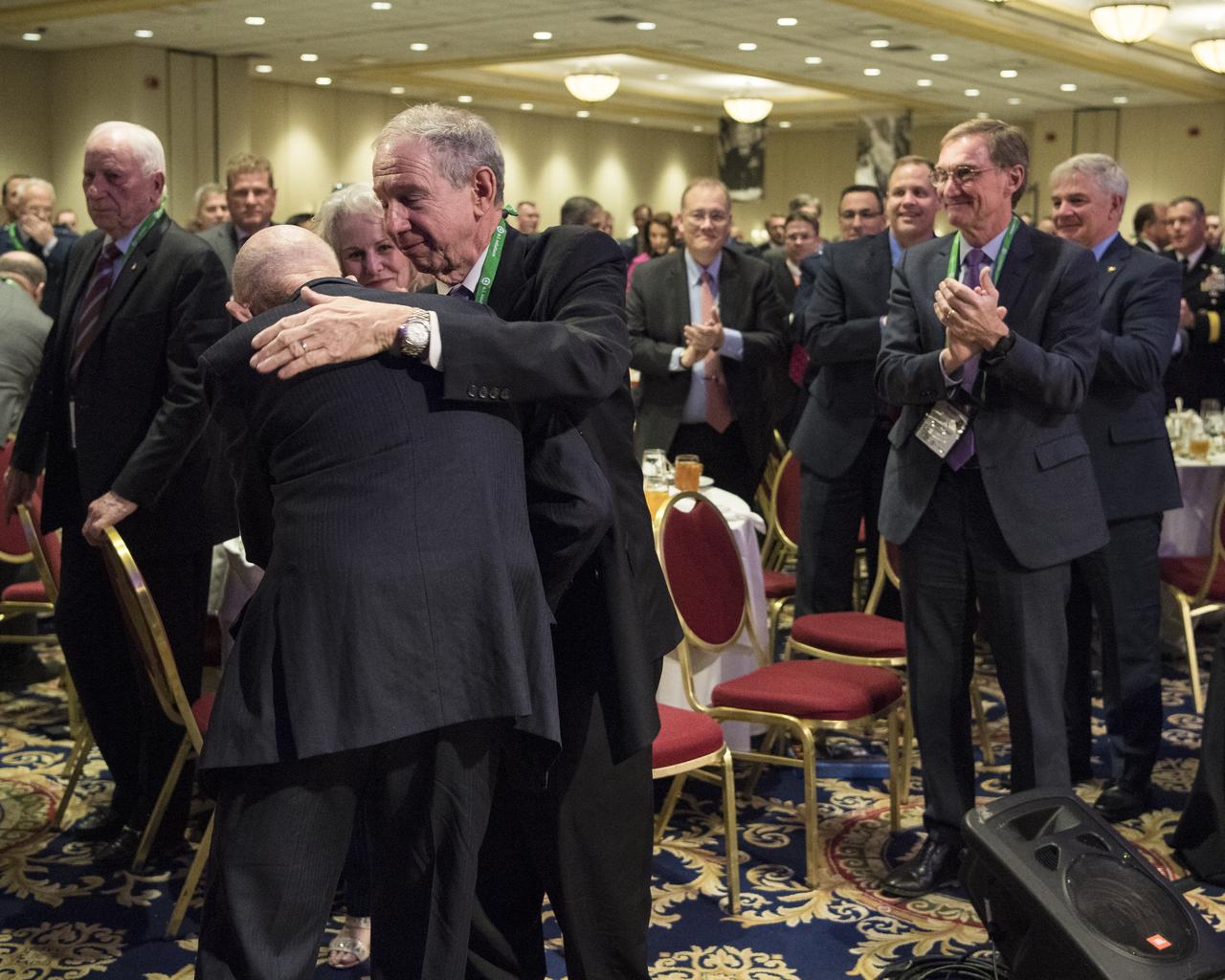 Former NASA Administrator Mike Griffin congratulates General Thomas Patten Stafford, former NASA astronaut, Air Force officer and test pilot at an event where he received the General James E. Hill Lifetime Achievement Award, at the Space Symposium, Tuesday, April 9, 2019, at Broadmoor Hall in Colorado Springs, Colorado. Photo credit: (NASA/Aubrey Gemignani)