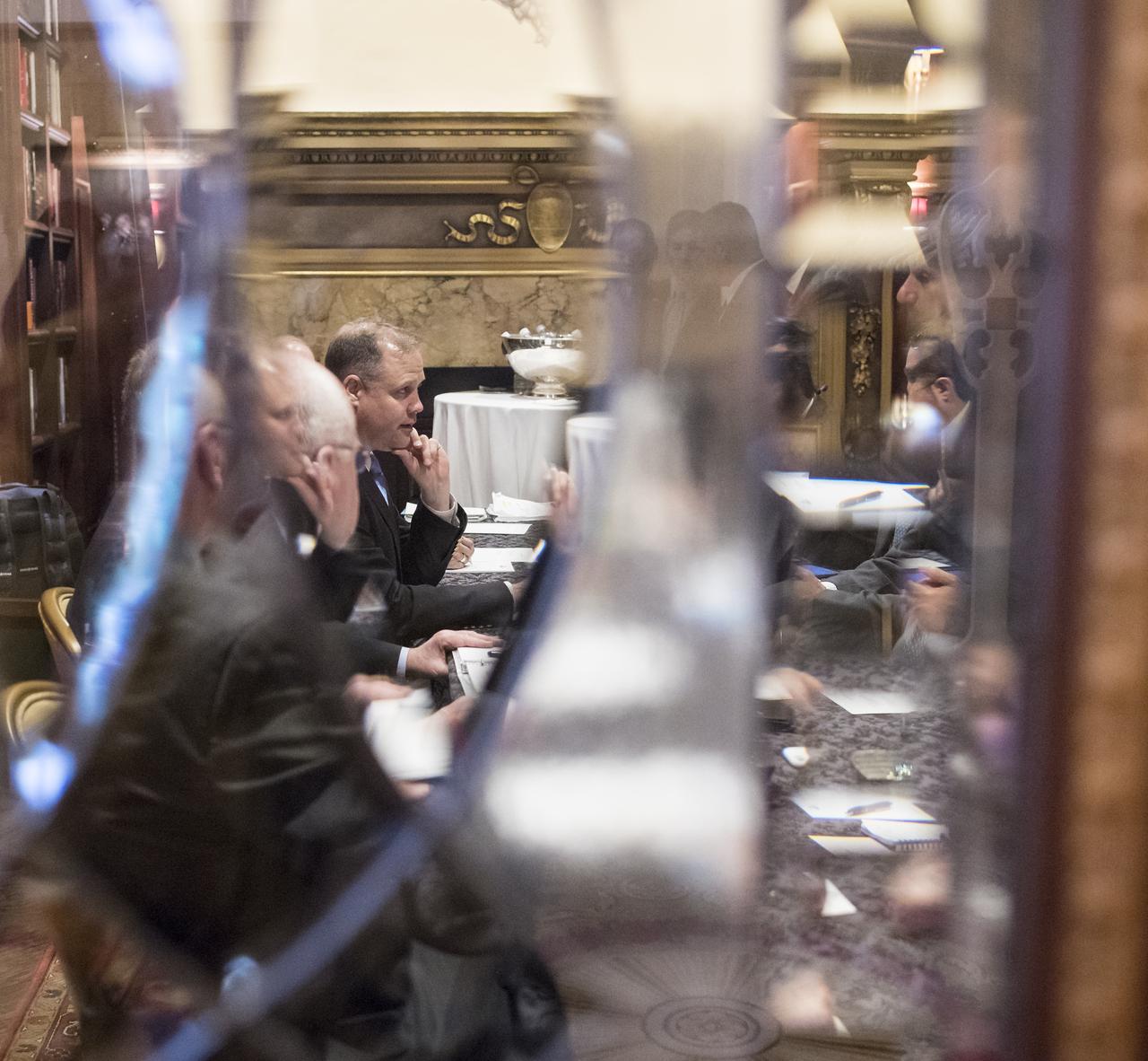 NASA Administrator Jim Bridenstine is seen through the door of the Pourtales Library, speaking with the Director General of the United Arab Emirates Space Agency (UAESA), Dr. Mohamed Al Ahbabi, about NASA’s plans to land humans on the Moon by 2024, UAESA’S human spaceflight objectives, and prospective cooperation involving the International Space Station and exploration of the Moon and Mars, at the Space Symposium, Wednesday, April 10, 2019 in Colorado Springs, Colorado. Photo Credit: (NASA/Aubrey Gemignani)
