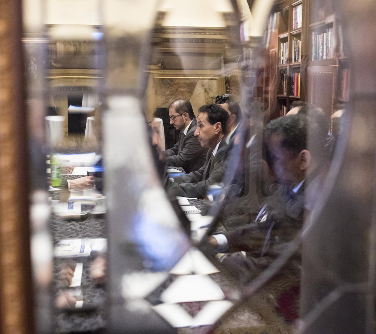 Director General of the United Arab Emirates Space Agency (UAESA), Dr. Mohamed Al Ahbabi, is seen through the door of the Pourtales Library speaking with NASA Administrator Jim Bridenstine about NASA’s plans to land humans on the Moon by 2024, UAESA’S human spaceflight objectives, and prospective cooperation involving the International Space Station and exploration of the Moon and Mars, at the Space Symposium, Wednesday, April 10, 2019 in Colorado Springs, Colorado. Photo Credit: (NASA/Aubrey Gemignani)