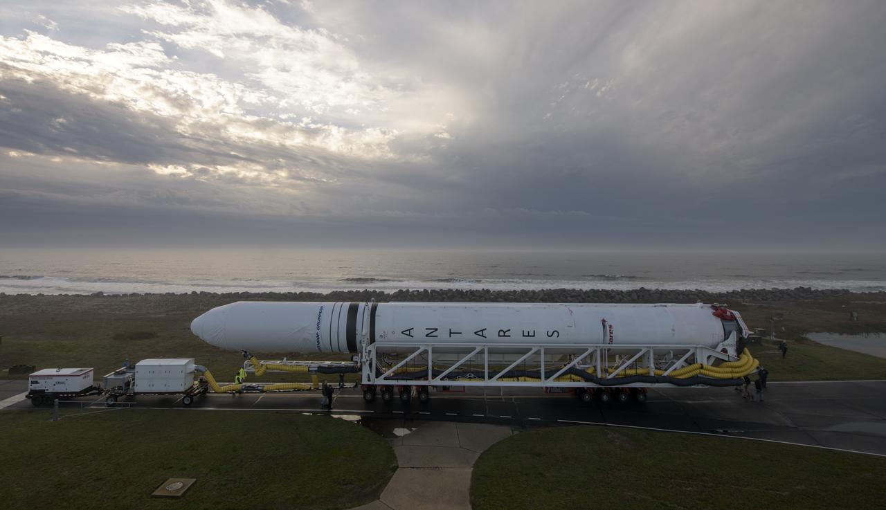 A Northrop Grumman Antares rocket is seen as it rolls out to Pad-0A, Monday, April 15, 2019 at NASA's Wallops Flight Facility in Virginia. Northrop Grumman’s 11th contracted cargo resupply mission with NASA to the International Space Station will deliver about 7,600 pounds of science and research, crew supplies and vehicle hardware to the orbital laboratory and its crew. Photo Credit: (NASA/Bill Ingalls)