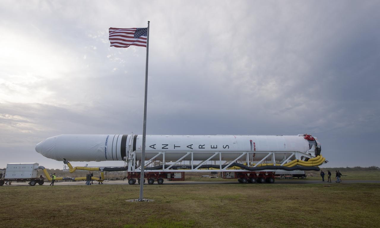 A Northrop Grumman Antares rocket is seen as it rolls out to Pad-0A, Monday, April 15, 2019 at NASA's Wallops Flight Facility in Virginia. Northrop Grumman’s 11th contracted cargo resupply mission with NASA to the International Space Station will deliver about 7,600 pounds of science and research, crew supplies and vehicle hardware to the orbital laboratory and its crew. Photo Credit: (NASA/Bill Ingalls)