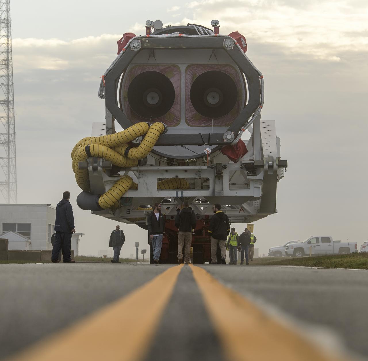 A Northrop Grumman Antares rocket is seen as it rolls out to Pad-0A, Monday, April 15, 2019 at NASA's Wallops Flight Facility in Virginia. Northrop Grumman’s 11th contracted cargo resupply mission with NASA to the International Space Station will deliver about 7,600 pounds of science and research, crew supplies and vehicle hardware to the orbital laboratory and its crew. Photo Credit: (NASA/Bill Ingalls)