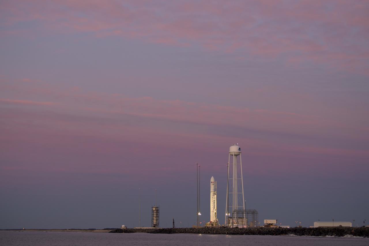A Northrop Grumman Antares rocket carrying a Cygnus resupply spacecraft is seen during sunrise on Pad-0A, Tuesday, April 16, 2019 at NASA's Wallops Flight Facility in Virginia. Northrop Grumman’s 11th contracted cargo resupply mission with NASA to the International Space Station will deliver about 7,600 pounds of science and research, crew supplies and vehicle hardware to the orbital laboratory and its crew. Photo Credit: (NASA/Bill Ingalls)