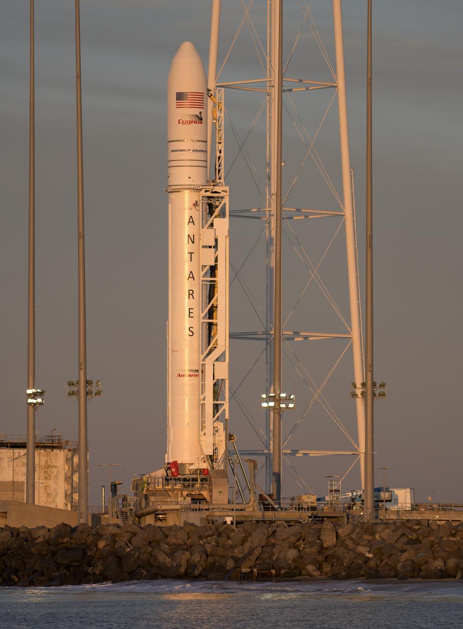 A Northrop Grumman Antares rocket carrying a Cygnus resupply spacecraft is seen during sunrise on Pad-0A, Tuesday, April 16, 2019 at NASA's Wallops Flight Facility in Virginia. Northrop Grumman’s 11th contracted cargo resupply mission with NASA to the International Space Station will deliver about 7,600 pounds of science and research, crew supplies and vehicle hardware to the orbital laboratory and its crew. Photo Credit: (NASA/Bill Ingalls)