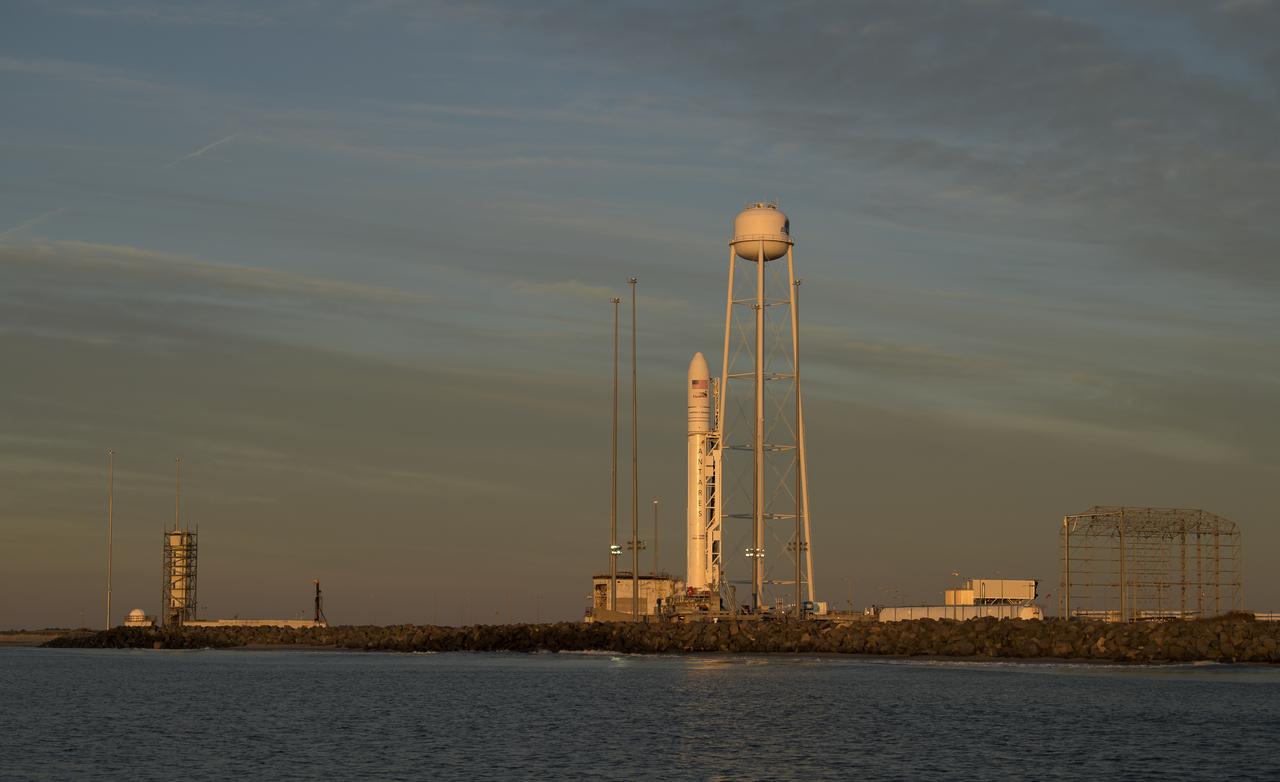 A Northrop Grumman Antares rocket carrying a Cygnus resupply spacecraft is seen during sunrise on Pad-0A, Tuesday, April 16, 2019 at NASA's Wallops Flight Facility in Virginia. Northrop Grumman’s 11th contracted cargo resupply mission with NASA to the International Space Station will deliver about 7,600 pounds of science and research, crew supplies and vehicle hardware to the orbital laboratory and its crew. Photo Credit: (NASA/Bill Ingalls)
