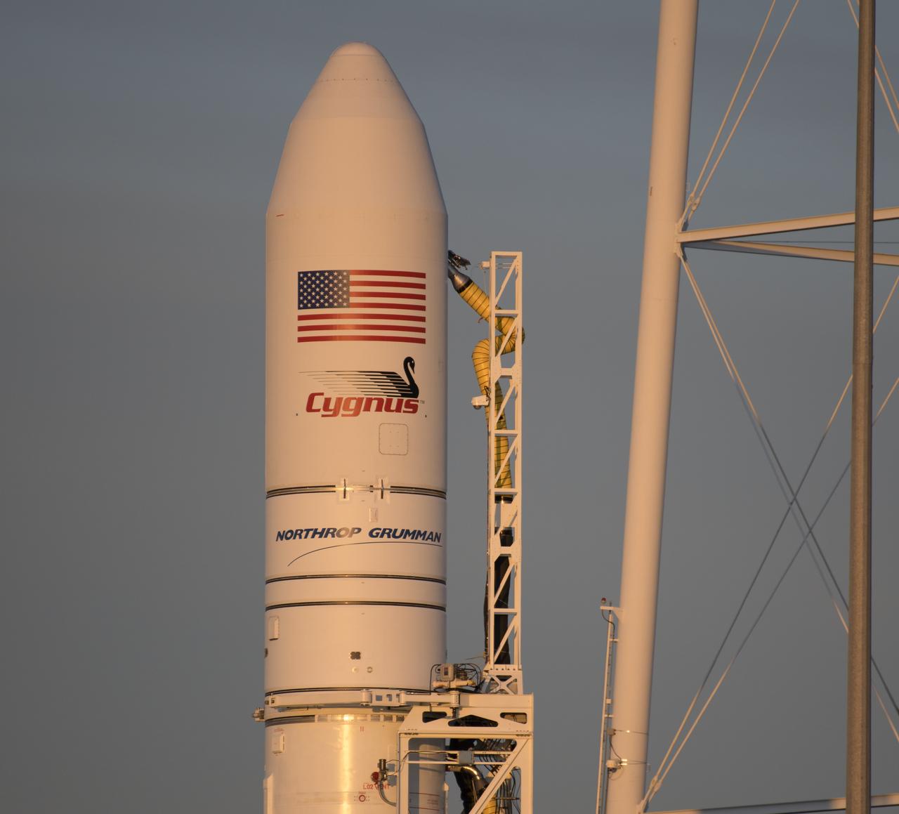 A Northrop Grumman Antares rocket carrying a Cygnus resupply spacecraft is seen during sunrise on Pad-0A, Tuesday, April 16, 2019 at NASA's Wallops Flight Facility in Virginia. Northrop Grumman’s 11th contracted cargo resupply mission with NASA to the International Space Station will deliver about 7,600 pounds of science and research, crew supplies and vehicle hardware to the orbital laboratory and its crew. Photo Credit: (NASA/Bill Ingalls)