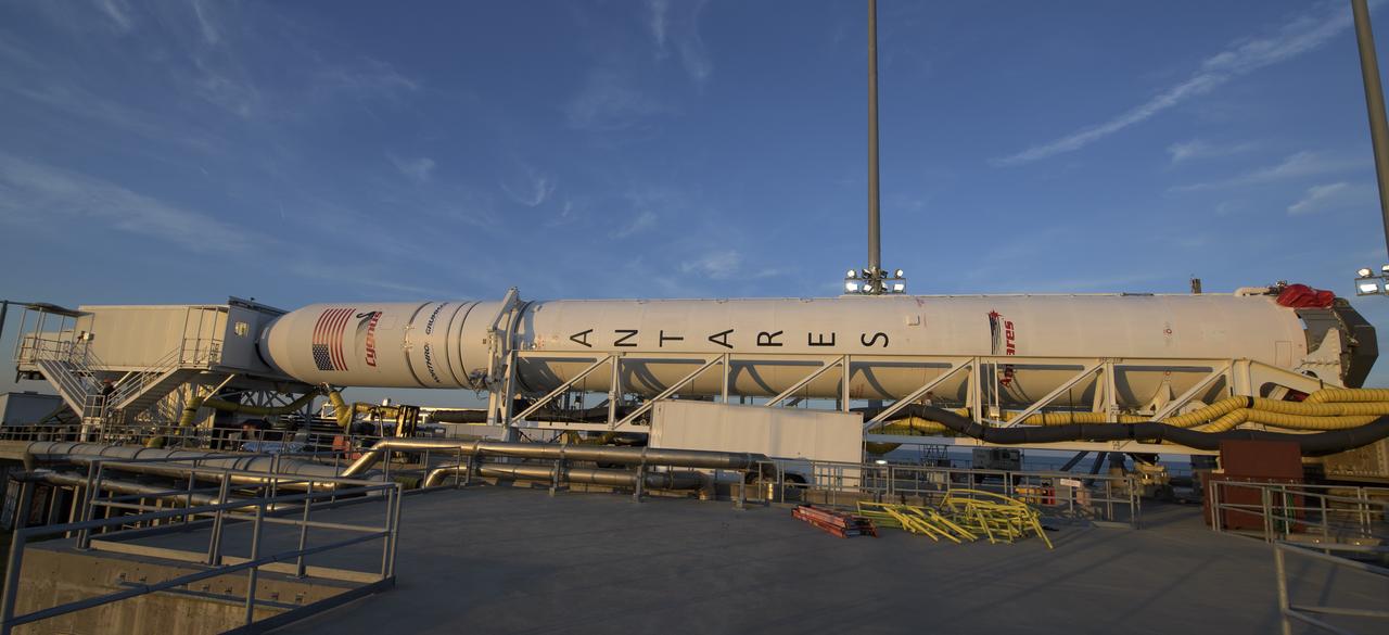A Northrop Grumman Antares rocket carrying a Cygnus resupply spacecraft is horizontal for the final cargo load on Pad-0A, Tuesday, April 16, 2019 at NASA's Wallops Flight Facility in Virginia. Northrop Grumman’s 11th contracted cargo resupply mission with NASA to the International Space Station will deliver about 7,600 pounds of science and research, crew supplies and vehicle hardware to the orbital laboratory and its crew. Photo Credit: (NASA/Bill Ingalls)