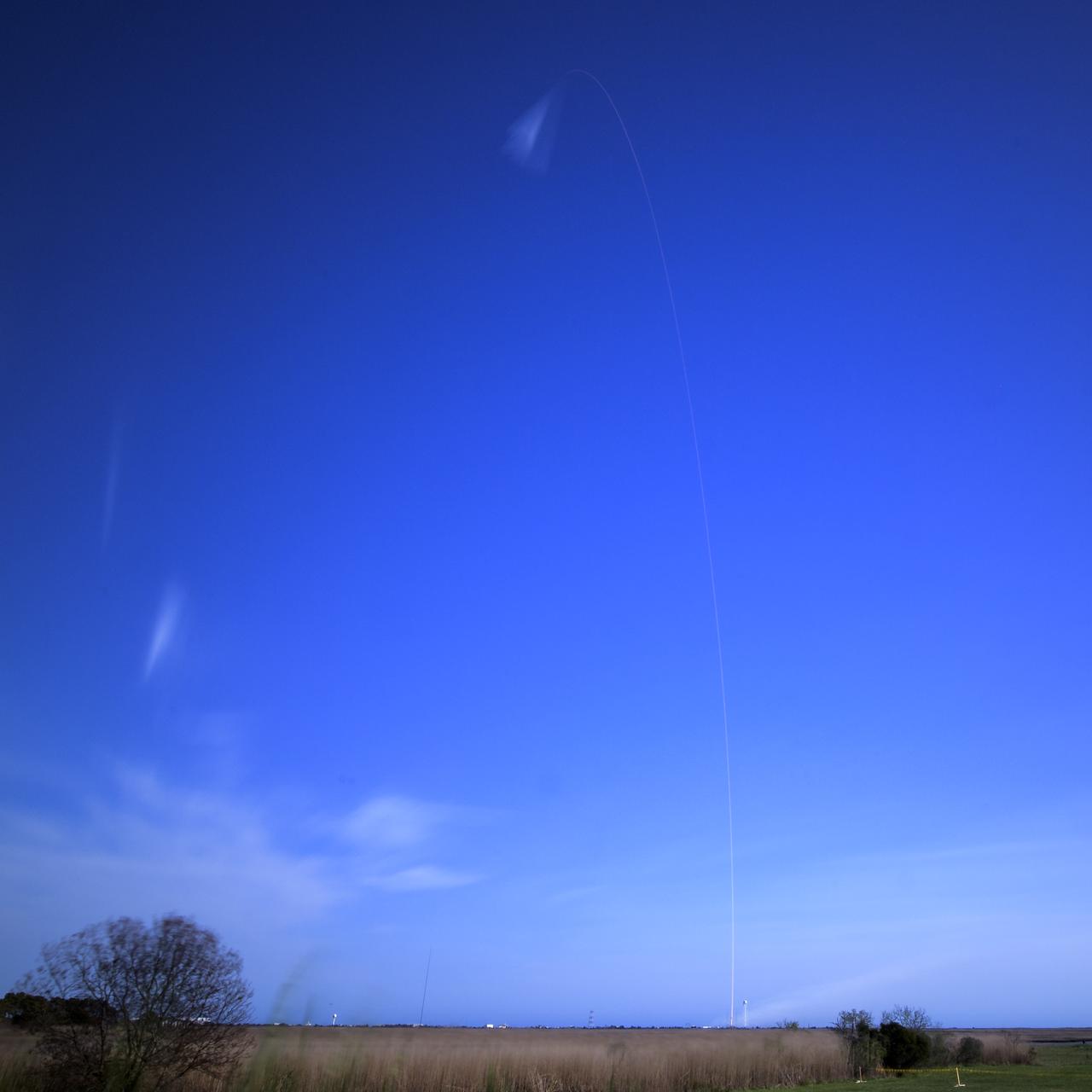 The Northrop Grumman Antares rocket, with Cygnus resupply spacecraft onboard, is seen in this long exposure photograph as it launches from Pad-0A, Wednesday, April 17, 2019 at NASA's Wallops Flight Facility in Virginia. Northrop Grumman's 11th contracted cargo resupply mission for NASA to the International Space Station will deliver about 7,600 pounds of science and research, crew supplies and vehicle hardware to the orbital laboratory and its crew. Photo Credit: (NASA/Bill Ingalls)