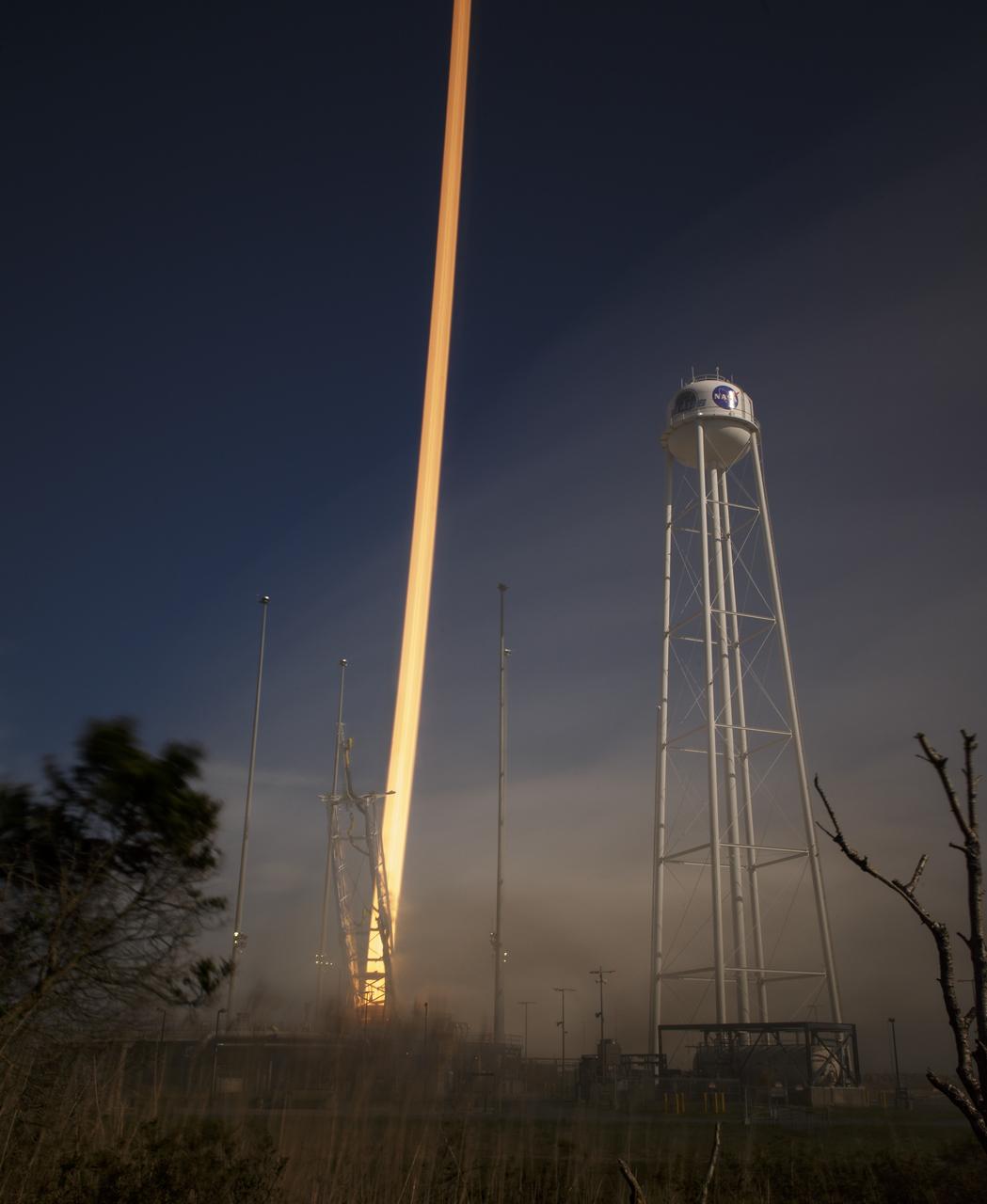 The Northrop Grumman Antares rocket, with Cygnus resupply spacecraft onboard, is seen in this long exposure photograph as it launches from Pad-0A, Wednesday, April 17, 2019 at NASA's Wallops Flight Facility in Virginia. Northrop Grumman's 11th contracted cargo resupply mission for NASA to the International Space Station will deliver about 7,600 pounds of science and research, crew supplies and vehicle hardware to the orbital laboratory and its crew. Photo Credit: (NASA/Bill Ingalls)