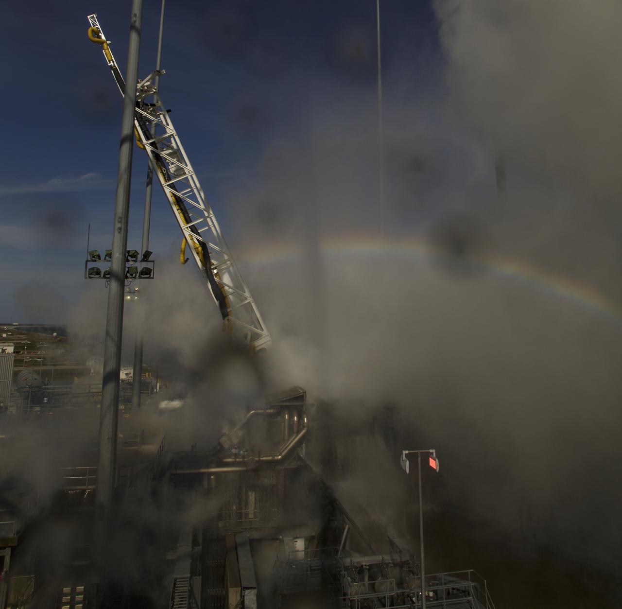A rainbow is seen at launch Pad-0A after the Northrop Grumman Antares rocket launched, Wednesday, April 17, 2019 at NASA's Wallops Flight Facility in Virginia. Northrop Grumman's 11th contracted cargo resupply mission for NASA to the International Space Station will deliver about 7,600 pounds of science and research, crew supplies and vehicle hardware to the orbital laboratory and its crew. Photo Credit: (NASA/Bill Ingalls)