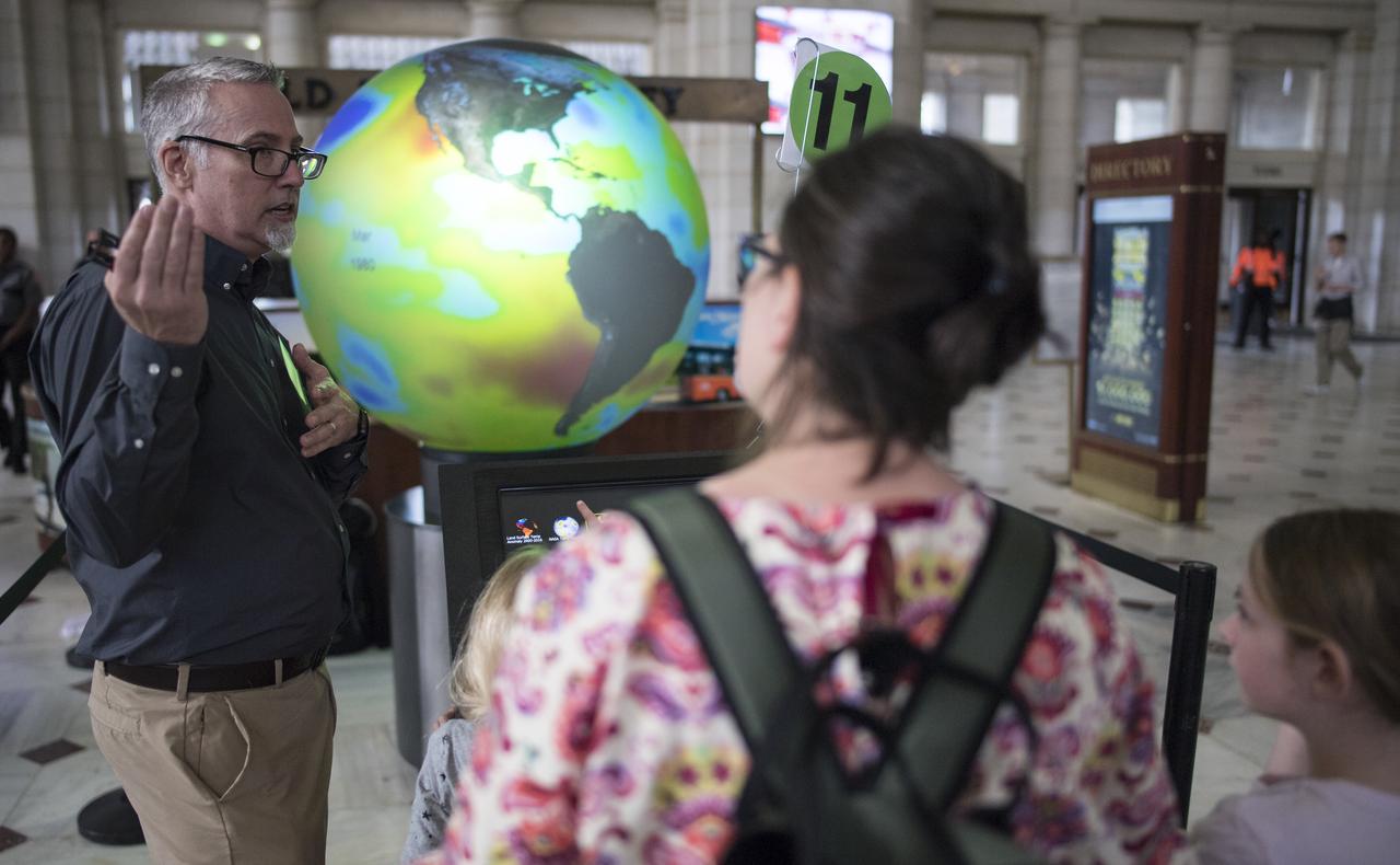 Visitors explore one of NASA's exhibits at the Earth Day event on Monday, April 22, 2019, at Union Station in Washington, D.C. Photo Credit: (NASA/Joel Kowsky)