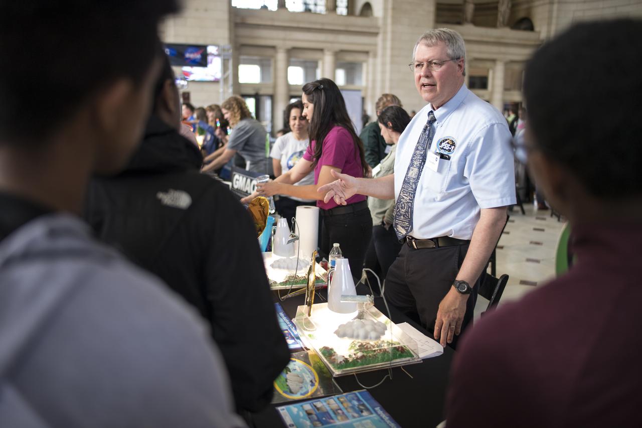 Visitors learn how satellites monitor the water cycle at one of NASA's exhibits at the Earth Day event on Monday, April 22, 2019, at Union Station in Washington, D.C. Photo Credit: (NASA/Joel Kowsky)