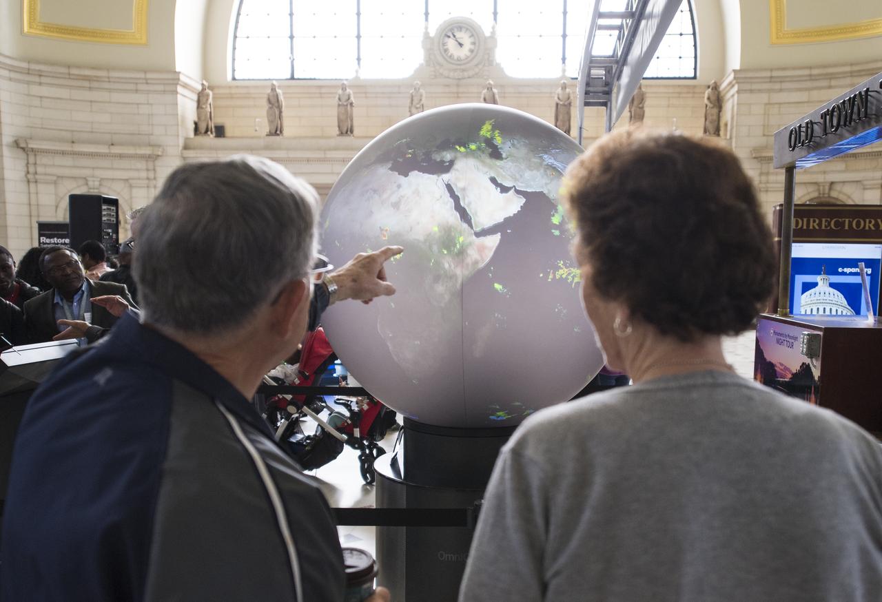 Visitors explore one of NASA's exhibits at the Earth Day event on Monday, April 22, 2019, at Union Station in Washington, D.C. Photo Credit: (NASA/Joel Kowsky)