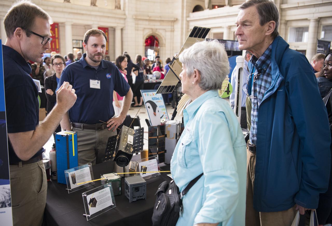 Visitors learn about CubeSats at of NASA's exhibits at the Earth Day event on Monday, April 22, 2019, at Union Station in Washington, D.C. Photo Credit: (NASA/Joel Kowsky)