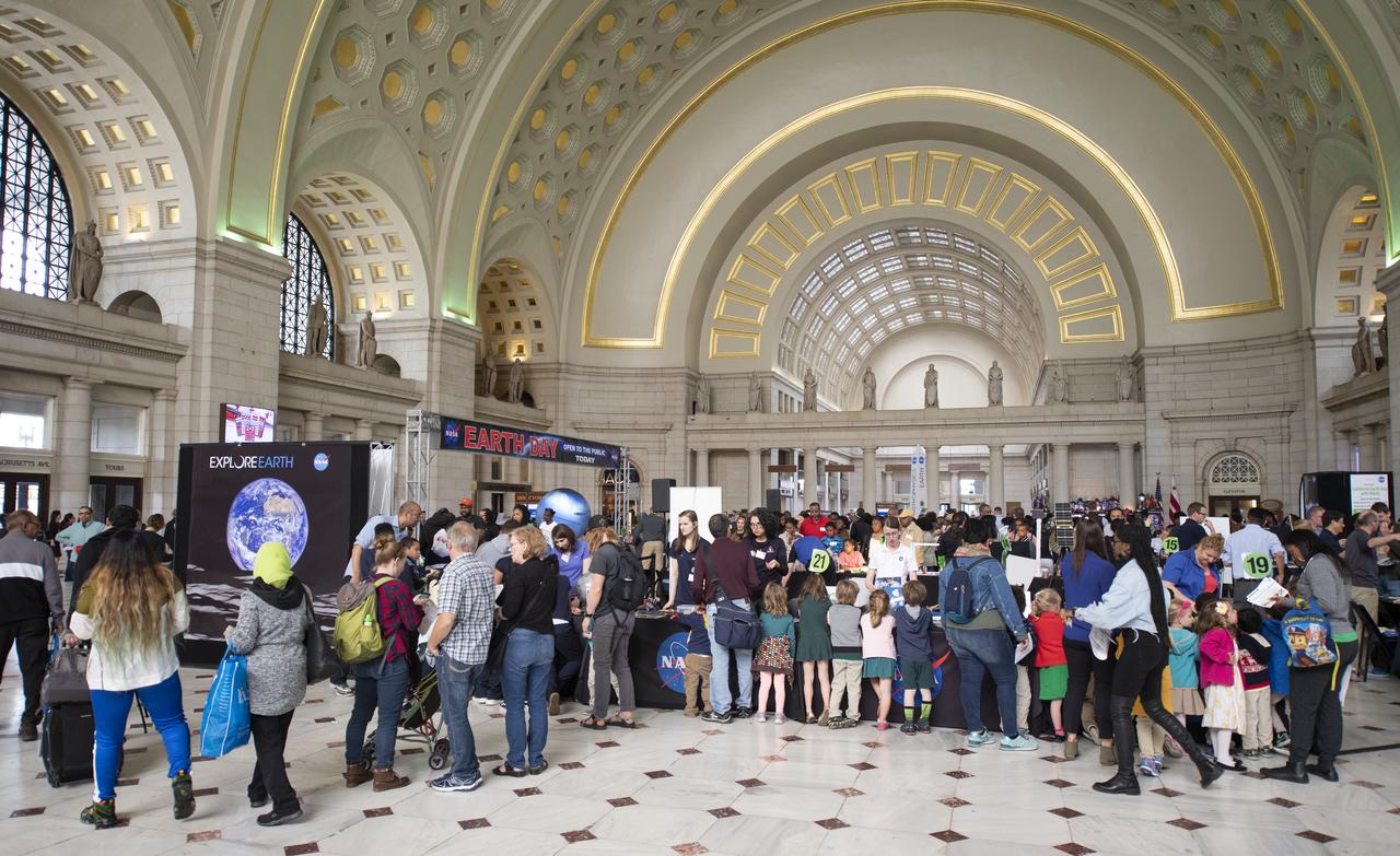 Visitors explore NASA's exhibits at the Earth Day event on Monday, April 22, 2019, at Union Station in Washington, D.C. Photo Credit: (NASA/Joel Kowsky)