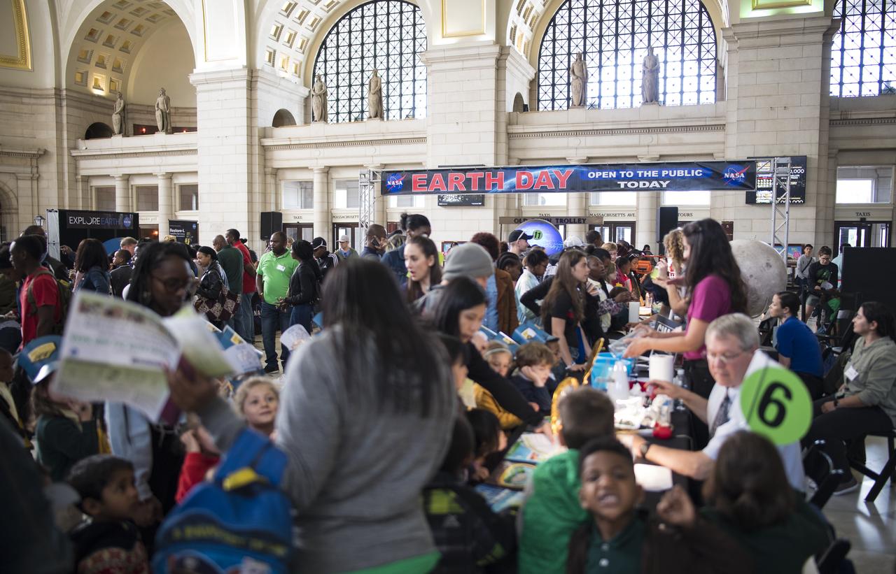 Visitors explore NASA's exhibits at the Earth Day event on Monday, April 22, 2019, at Union Station in Washington, D.C. Photo Credit: (NASA/Joel Kowsky)