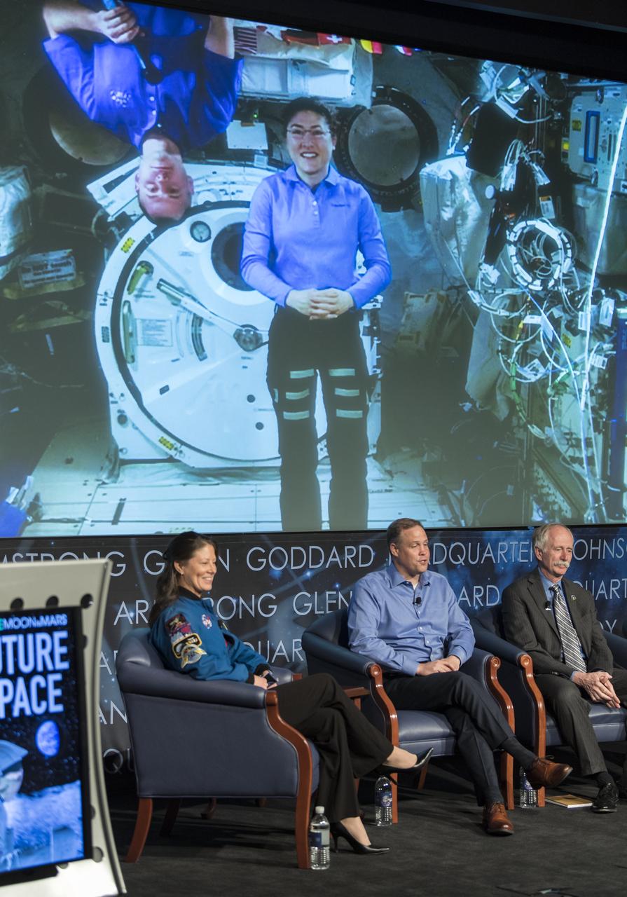 Nick Hague, left, and Christina Koch, two astronauts currently living and working on the International Space Station, are seen on the screen during a live uplink and panel discussion with NASA Administrator Jim Bridenstine, center, NASA Associate Administrator for the Human Exploration and Operations Mission Directorate, Bill Gerstenmaier, right, and NASA Deputy Associate Administrator for Exploration, Steve Clarke, not pictured, at the "Future of Space" STEM event, Monday, April 29, 2019 at NASA Headquarters in Washington. NASA astronaut Tracy Caldwell Dyson, left, moderated the panel discussion. Photo Credit: (NASA/Aubrey Gemignani)
