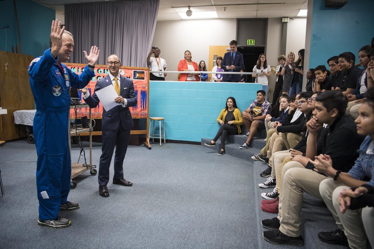 NASA astronaut Ricky Arnold is introduced to speak about his time onboard the International Space Station (ISS) during Expeditions 55 and 56, Friday, May 3, 2019 at the Challenger Center in Lanham, MD. During Expedition 55/56, Arnold completed three spacewalks for a total of 19.5 hours outside the space station, and concluded his 197 day mission when he landed in a remote area near the town of Zhezkazgan, Kazakhstan in Oct. 2018. He also flew to the space station on shuttle mission STS-119 to deliver the final pair of power-generating solar array wings. Photo Credit: (NASA/Aubrey Gemignani)