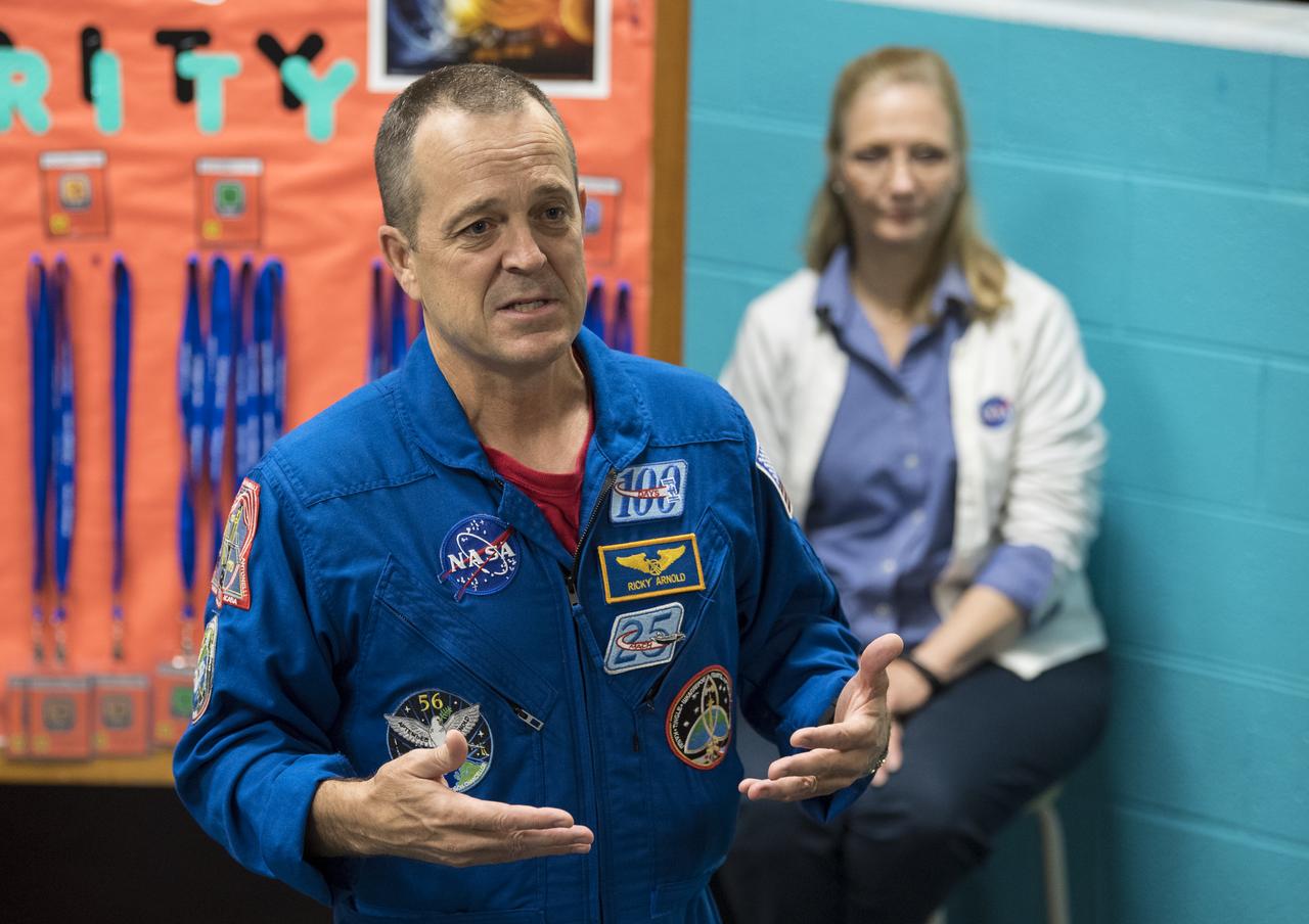 NASA astronaut Ricky Arnold speaks about his time onboard the International Space Station (ISS) during Expeditions 55 and 56, Friday, May 3, 2019 at the Challenger Center in Lanham, MD. During Expedition 55/56, Arnold completed three spacewalks for a total of 19.5 hours outside the space station, and concluded his 197 day mission when he landed in a remote area near the town of Zhezkazgan, Kazakhstan in Oct. 2018. He also flew to the space station on shuttle mission STS-119 to deliver the final pair of power-generating solar array wings. Photo Credit: (NASA/Aubrey Gemignani)