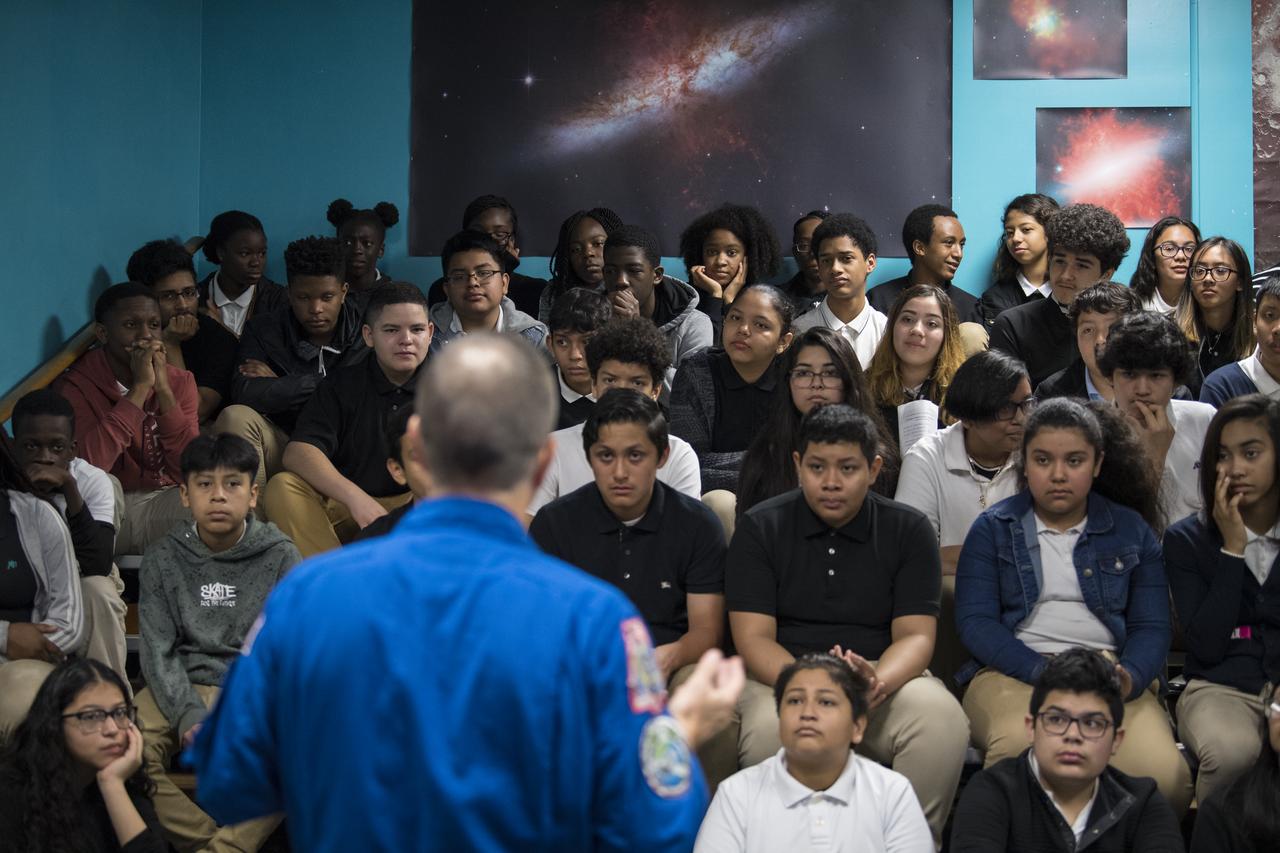NASA astronaut Ricky Arnold speaks about his time onboard the International Space Station (ISS) during Expeditions 55 and 56, Friday, May 3, 2019 at the Challenger Center in Lanham, MD. During Expedition 55/56, Arnold completed three spacewalks for a total of 19.5 hours outside the space station, and concluded his 197 day mission when he landed in a remote area near the town of Zhezkazgan, Kazakhstan in Oct. 2018. He also flew to the space station on shuttle mission STS-119 to deliver the final pair of power-generating solar array wings. Photo Credit: (NASA/Aubrey Gemignani)