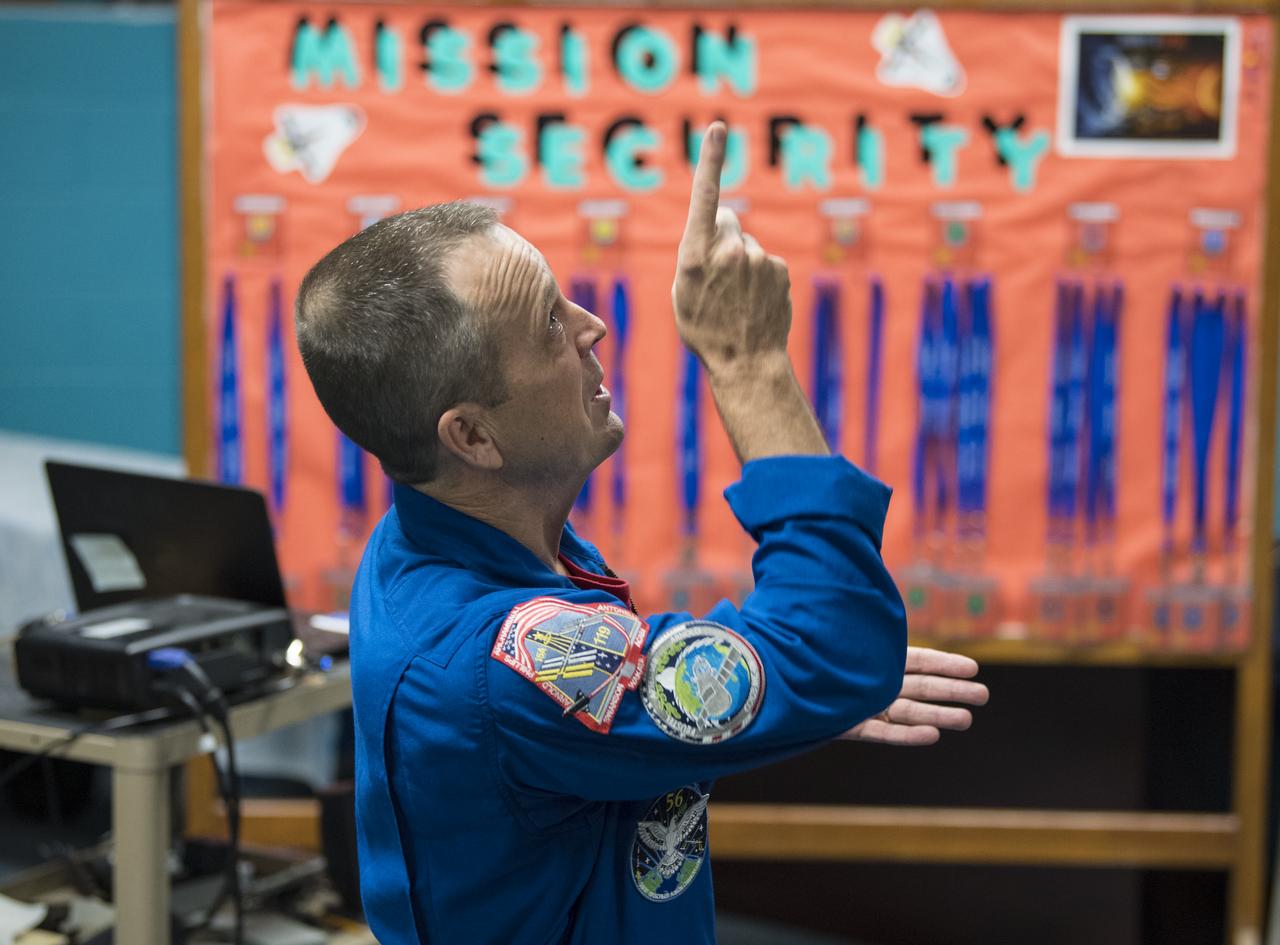 NASA astronaut Ricky Arnold speaks about his time onboard the International Space Station (ISS) during Expeditions 55 and 56, Friday, May 3, 2019 at the Challenger Center in Lanham, MD. During Expedition 55/56, Arnold completed three spacewalks for a total of 19.5 hours outside the space station, and concluded his 197 day mission when he landed in a remote area near the town of Zhezkazgan, Kazakhstan in Oct. 2018. He also flew to the space station on shuttle mission STS-119 to deliver the final pair of power-generating solar array wings. Photo Credit: (NASA/Aubrey Gemignani)