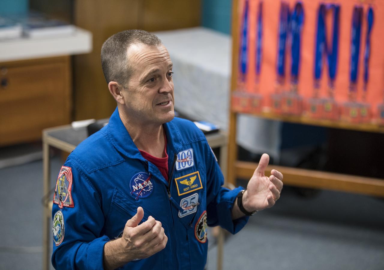 NASA astronaut Ricky Arnold speaks about his time onboard the International Space Station (ISS) during Expeditions 55 and 56, Friday, May 3, 2019 at the Challenger Center in Lanham, MD. During Expedition 55/56, Arnold completed three spacewalks for a total of 19.5 hours outside the space station, and concluded his 197 day mission when he landed in a remote area near the town of Zhezkazgan, Kazakhstan in Oct. 2018. He also flew to the space station on shuttle mission STS-119 to deliver the final pair of power-generating solar array wings. Photo Credit: (NASA/Aubrey Gemignani)