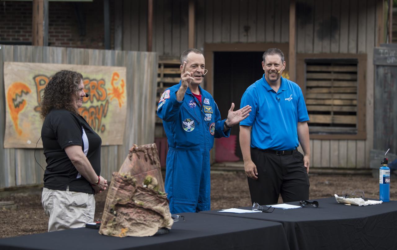 NASA astronaut Ricky Arnold answers questions from the audience about his time onboard the International Space Station (ISS) during a Smithsonian National Air and Space Museum production of Stem in 30, Friday, May 3, 2019 at Six Flags America theme park in Upper Marlboro, MD. During Expedition 55/56, Arnold completed three spacewalks for a total of 19.5 hours outside the space station, and concluded his 197 day mission when he landed in a remote area near the town of Zhezkazgan, Kazakhstan in Oct. 2018. He also flew to the space station on shuttle mission STS-119 to deliver the final pair of power-generating solar array wings. Photo Credit: (NASA/Aubrey Gemignani)