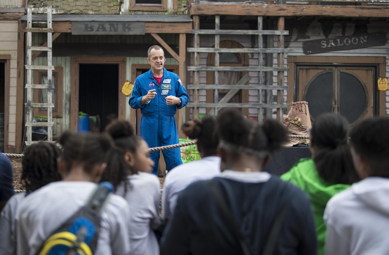 NASA astronaut Ricky Arnold answers questions from the audience about his time onboard the International Space Station (ISS) during a Smithsonian National Air and Space Museum production of Stem in 30, Friday, May 3, 2019 at Six Flags America theme park in Upper Marlboro, MD. During Expedition 55/56, Arnold completed three spacewalks for a total of 19.5 hours outside the space station, and concluded his 197 day mission when he landed in a remote area near the town of Zhezkazgan, Kazakhstan in Oct. 2018. He also flew to the space station on shuttle mission STS-119 to deliver the final pair of power-generating solar array wings. Photo Credit: (NASA/Aubrey Gemignani)