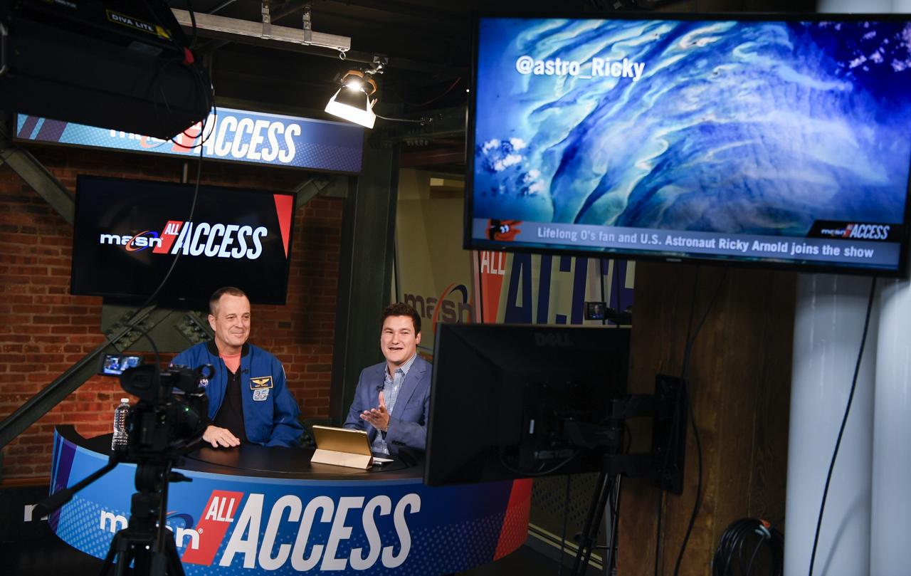 NASA astronaut and Maryland native Ricky Arnold is interviewed by Paul Mancano of MASN All Access before the Tampa Bay Rays take on the Baltimore Orioles, Saturday, May 4, 2019 at Camden Yards in Baltimore, Md. During Arnold’s 197 days onboard the International Space Station, as part of Expeditions 55 and 56, he ventured outside the space station on three spacewalks in addition to conducting numerous experiments and educational downlink events. Photo Credit: (NASA/Joel Kowsky)