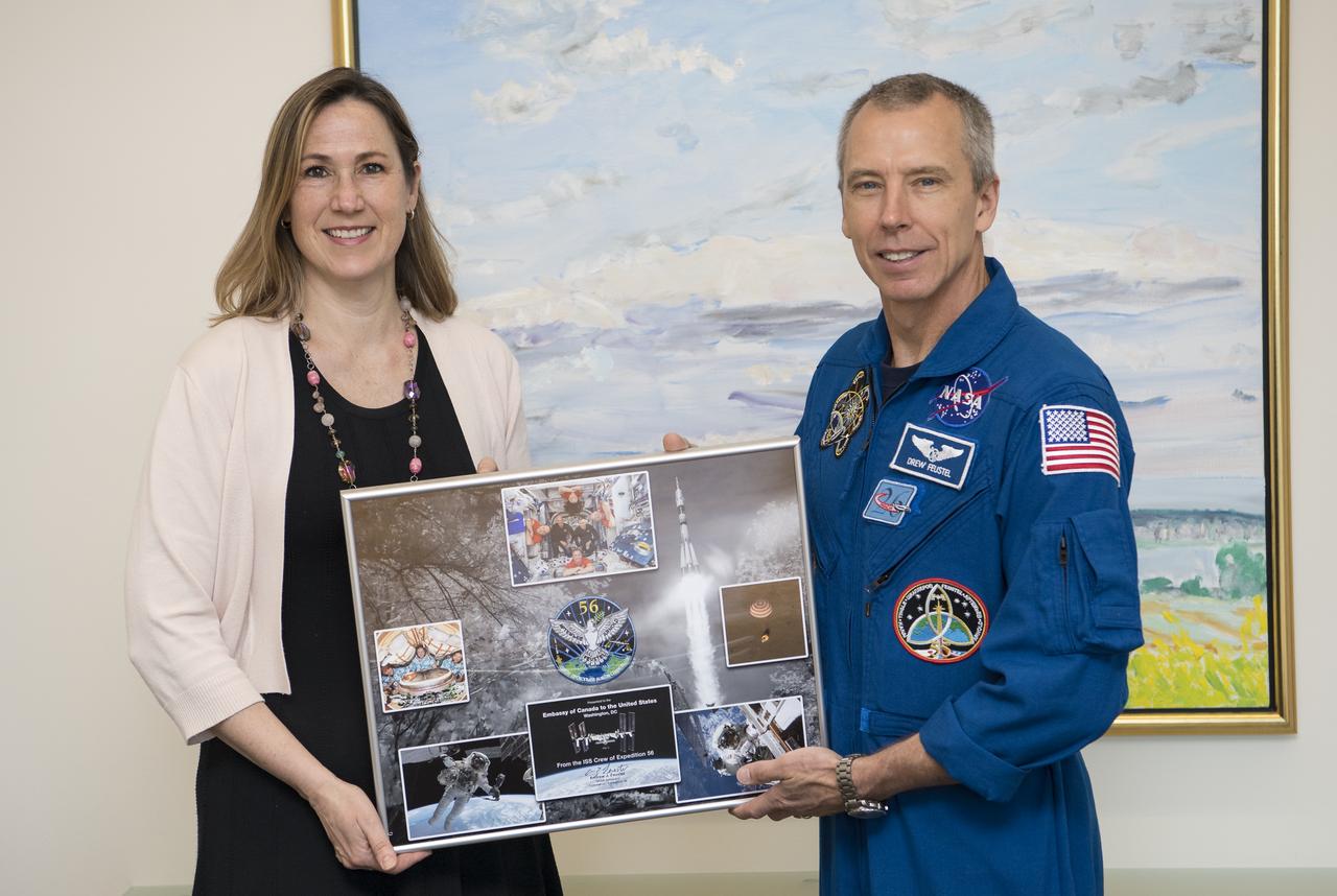 NASA astronaut Drew Feustel poses for a photo after presenting Canadian Deputy Ambassador to the U.S., Kirsten Hillman, a montage from Expeditions 55 and 56 to the International Space Station, Monday, May 6, 2019 in Washington. Photo Credit: (NASA/Aubrey Gemignani)