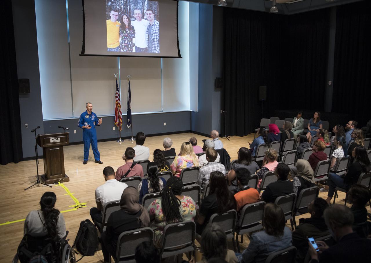 NASA astronaut Drew Feustel speaks about his experience on two shuttle missions, STS-125 and STS-134, as well as Expeditions 55 and 56 on the International Space Station, at Northern Virginia Community College's Alexandria campus, Monday, May 6, 2019 in Virginia. Photo Credit: (NASA/Aubrey Gemignani)
