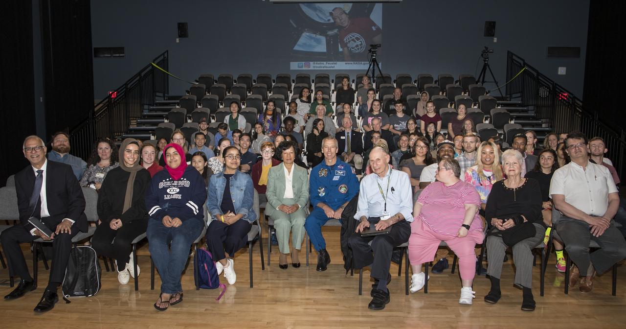 NASA astronaut Drew Feustel, center right, poses for a photo with Northern Virginia Community College's Alexandria campus provost, Dr. Annette Haggray, center left, and attendees of his presentation on spaceflight, Monday, May 6, 2019 in Virginia. Photo Credit: (NASA/Aubrey Gemignani)