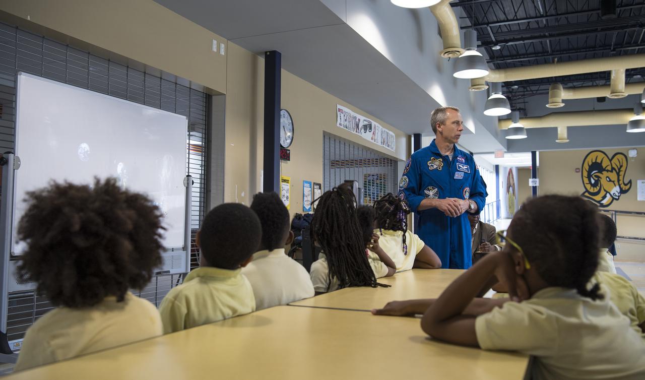NASA astronaut Drew Feustel speaks to students at John Burroughs Elementary School about his experiences on two space shuttle missions, STS-125 and STS-134, and a long duration mission onboard the International Space Station, Tuesday, May 7, 2019 in Washington, DC. Feustel most recently spent 197 days living and working onboard the International Space Station as part of Expedition 55 and as commander of Expedition 56. Feustel ventured outside the space station on three spacewalks, moving him up to second among U.S. spacewalkers with a cumulative time of 61 hours 48 minutes over nine spacewalks. Photo Credit: (NASA/Joel Kowsky)