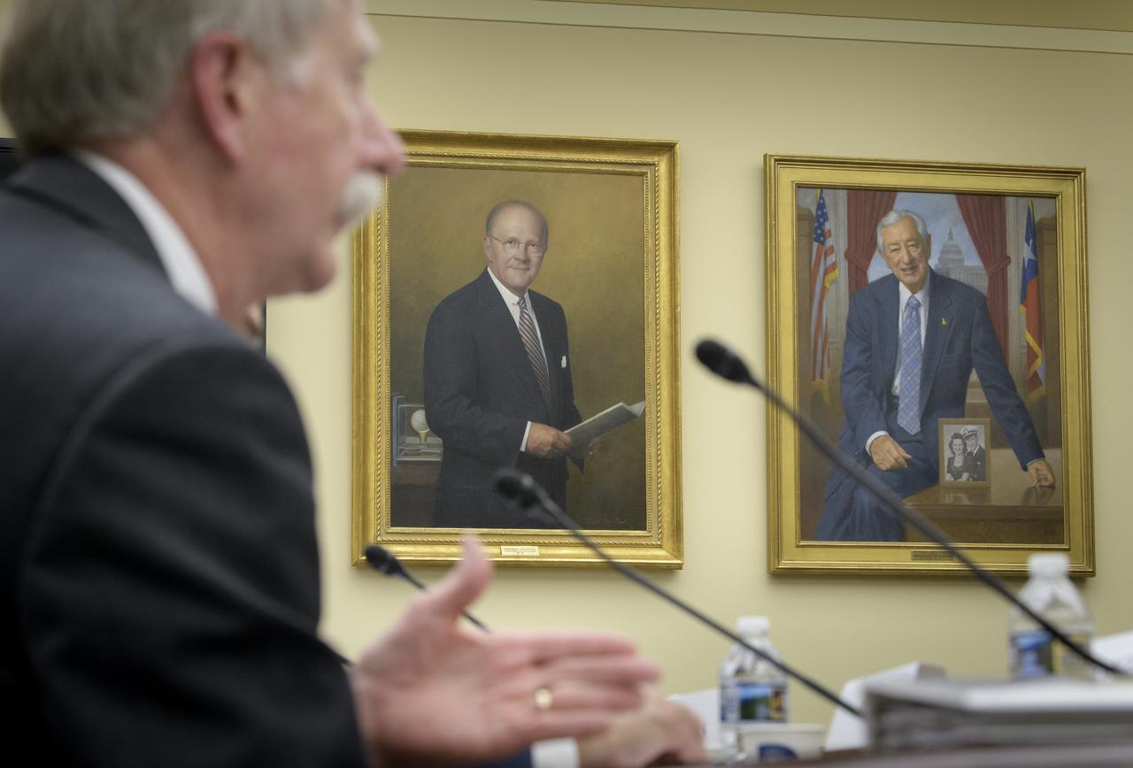 Portraits of past House Science and Technology Committee Chairmen, Sherwood Boehlert, left, and Ralph Hall are seen as NASA Associate Administrator, Human Exploration and Operations William Gerstenmaier testifies during a House Subcommittee on Space and Aeronautics hearing titled "Keeping our sights on Mars: A Review of NASA's Deep Space Exploration Programs and Lunar Proposal", Wednesday, May 8, 2019 at the Rayburn House Office Building in Washington. Photo Credit: (NASA/Bill Ingalls)