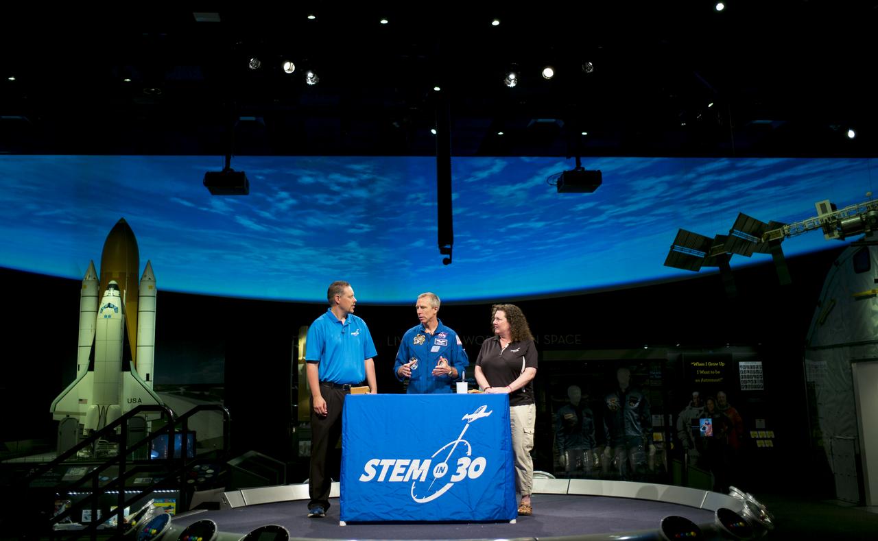NASA astronaut Drew Feustel, center, tapes a segment of STEM in 30 with Marty Kelsey, left, and Beth Wilson, right, Thursday, May 9, 2019 at the Smithsonian’s National Air and Space Museum in Washington, DC. Feustel most recently spent 197 days living and working onboard the International Space Station as part of Expedition 55 and as commander of Expedition 56. Feustel ventured outside the space station on three spacewalks, moving him up to second among U.S. spacewalkers with a cumulative time of 61 hours 48 minutes over nine spacewalks. Photo Credit: (NASA/Joel Kowsky)
