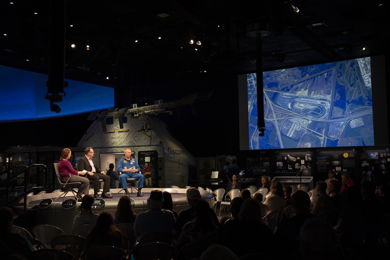 Smithsonian National Air and Space Museum curators Jennifer Levasseur, left, and Jeremy Kinney, center, speak with NASA astronaut Drew Feustel about photographing racetracks around the world during his time onboard the International Space Station during “What’s New in Aerospace,” Thursday, May 9, 2019 at the Smithsonian’s National Air and Space Museum in Washington, DC. Feustel most recently spent 197 days living and working onboard the International Space Station as part of Expedition 55 and as commander of Expedition 56. Feustel ventured outside the space station on three spacewalks, moving him up to second among U.S. spacewalkers with a cumulative time of 61 hours 48 minutes over nine spacewalks. Photo Credit: (NASA/Joel Kowsky)