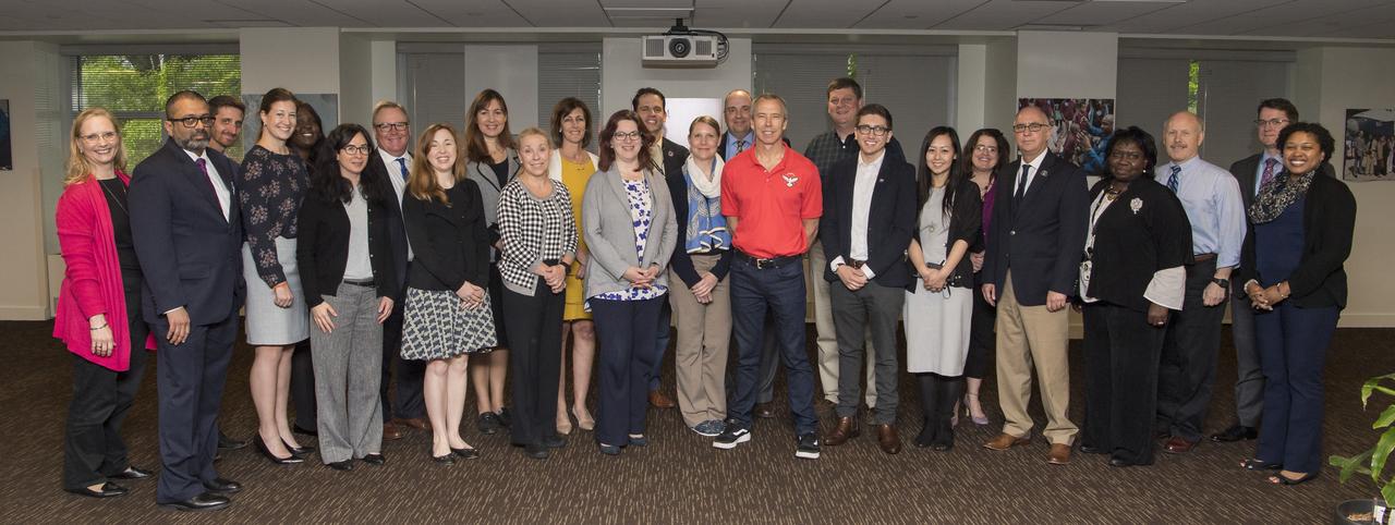 NASA astronaut Drew Feustel poses for a photo with the NASA Human Exploration and Operations team just after speaking about his experience on two space shuttle missions, STS-125 and STS-134, and a long duration mission onboard the International Space Station at NASA Headquarters, Thursday, May 9, 2019 in Washington, DC. Feustel most recently spent 197 days living and working onboard the International Space Station as part of Expedition 55 and as commander of Expedition 56. Feustel ventured outside the space station on three spacewalks, moving him up to second among U.S. spacewalkers with a cumulative time of 61 hours 48 minutes over nine spacewalks. Photo Credit: (NASA/Aubrey Gemignani)