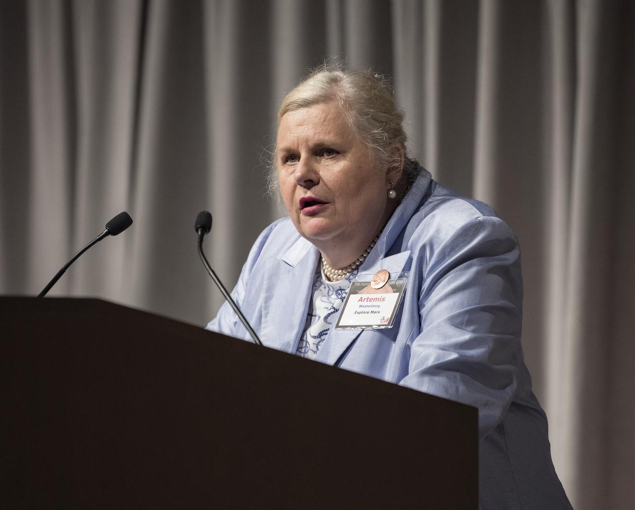 Explore Mars President and Co-Founder, Artemis Westenberg, introduces NASA Administrator Jim Bridenstine at the Humans to Mars Summit, Tuesday, May 14, 2019, at the National Academy of Sciences in Washington. Photo credit: (NASA/Aubrey Gemignani)