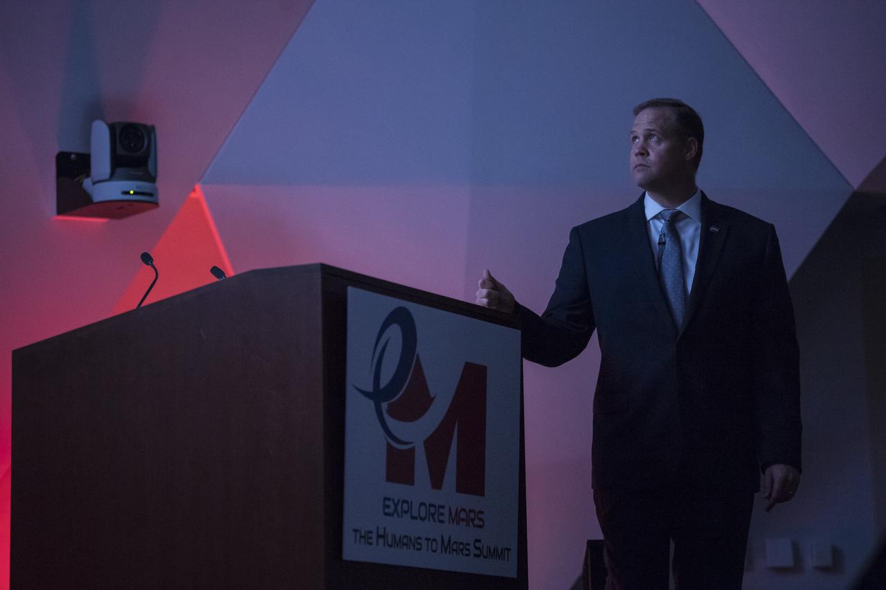 NASA Administrator Jim Bridenstine watches the "We Are NASA" film just after giving keynote remarks at the Humans to Mars Summit, Tuesday, May 14, 2019, at the National Academy of Sciences in Washington. Photo credit: (NASA/Aubrey Gemignani)
