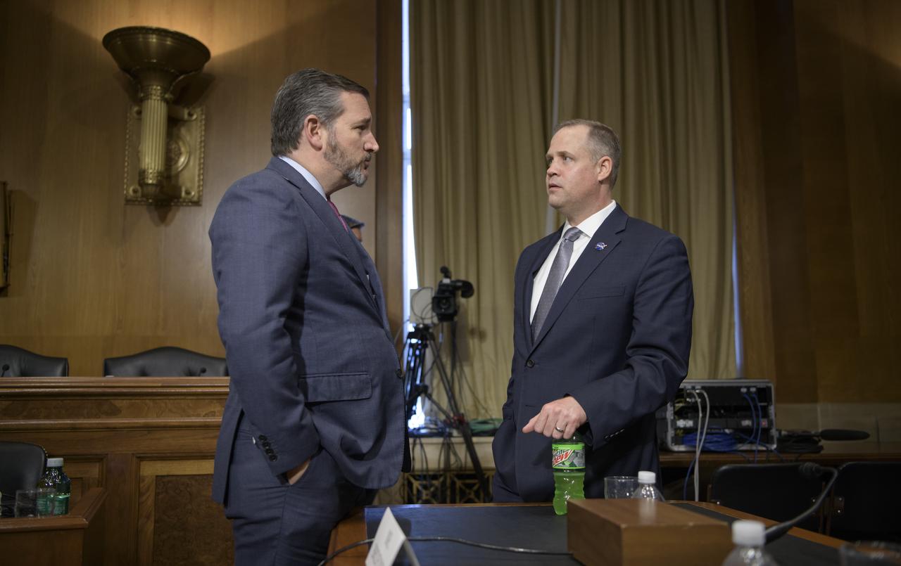 Sen. Ted Cruz, R-Texas, chairman of the Subcommittee on Aviation and Space, left, and NASA Administrator Jim Bridenstine talk after a hearing titled “The Emerging Space Environment: Operational, Technical, and Policy Challenges.”, Tuesday, May 14, 2019, at the Dirksen Senate Office Building in Washington. Photo Credit: (NASA/Bill Ingalls)