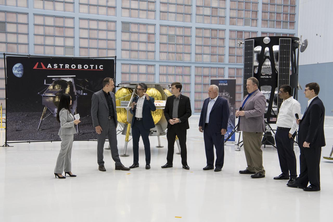 Astrobotic Mission Director, Sharad Bhaskaran , third from left, speaks about their lunar lander with, from left to right, NASA Press Officer, Felicia Chou; NASA Associate Administrator, Science Mission Directorate, Thomas Zurbuchen; Astrobotic CEO, John Thornton; Chairman of the Board of Intuitive Machines, Kam Ghaffarian; VP of Research and Development of Intuitive Machines, Tim Crain; President and CEO of OrbitBeyond, Siba Padhi; and Chief Science Officer, OrbitBeyond, Jon Morse, Friday, May 31, 2019, at Goddard Space Flight Center in Md. Astrobotic, Intuitive Machines, and OrbitBeyond have been selected to provide the first lunar landers for the Artemis program's lunar surface exploration. Photo credit: (NASA/Aubrey Gemignani)